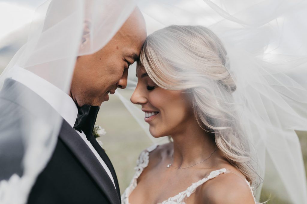 Covid-19 and Your Wedding // Part One: The Reality of Postponement - on the Bronte Bride Blog - Wedding Postponement how to, tips & advice from the pros, bride & groom, calgary wedding photographer, veil shot