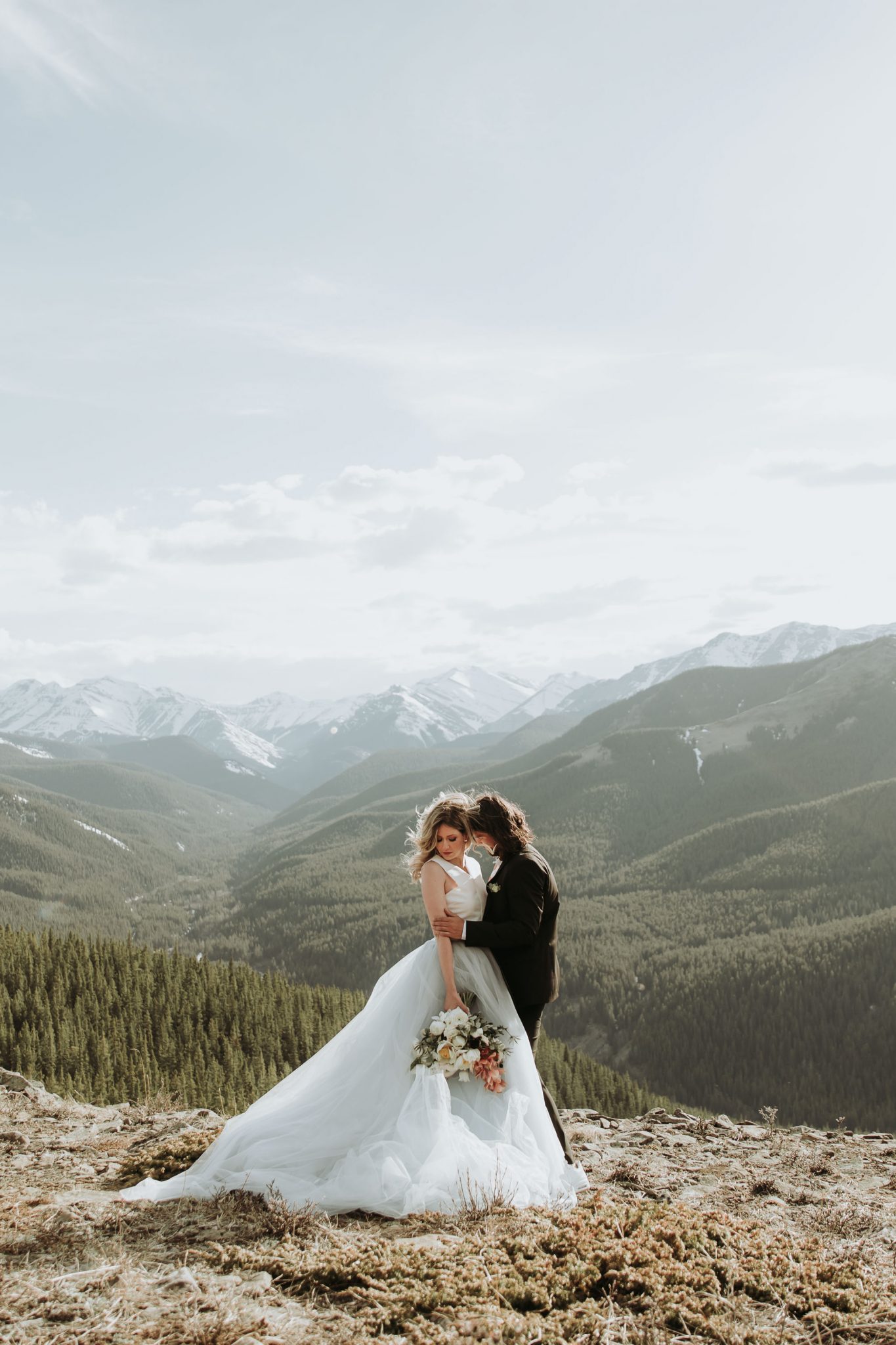 Mountainous Adventure Session with modern bride and groom featuring Contemporary Attire & Alberta Views Featured on Bronte Bridë