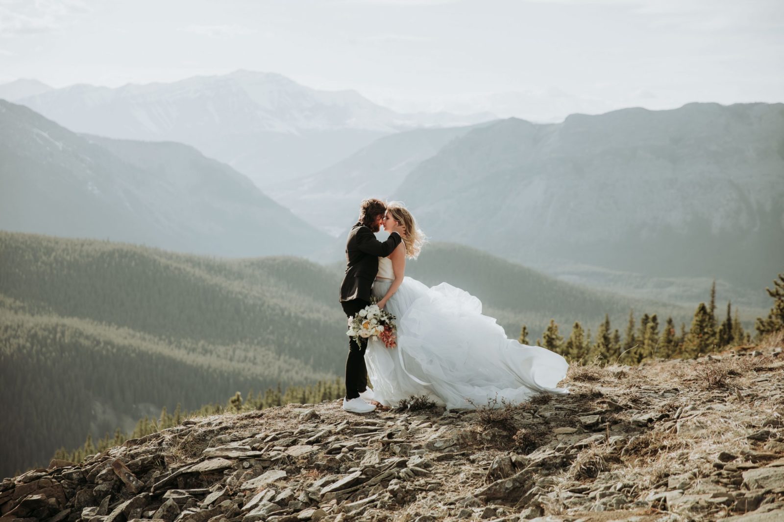 Mountainous Adventure Session featuring Contemporary Attire & Alberta Views Featured on Bronte Bridë with Romantic Wedding Dress