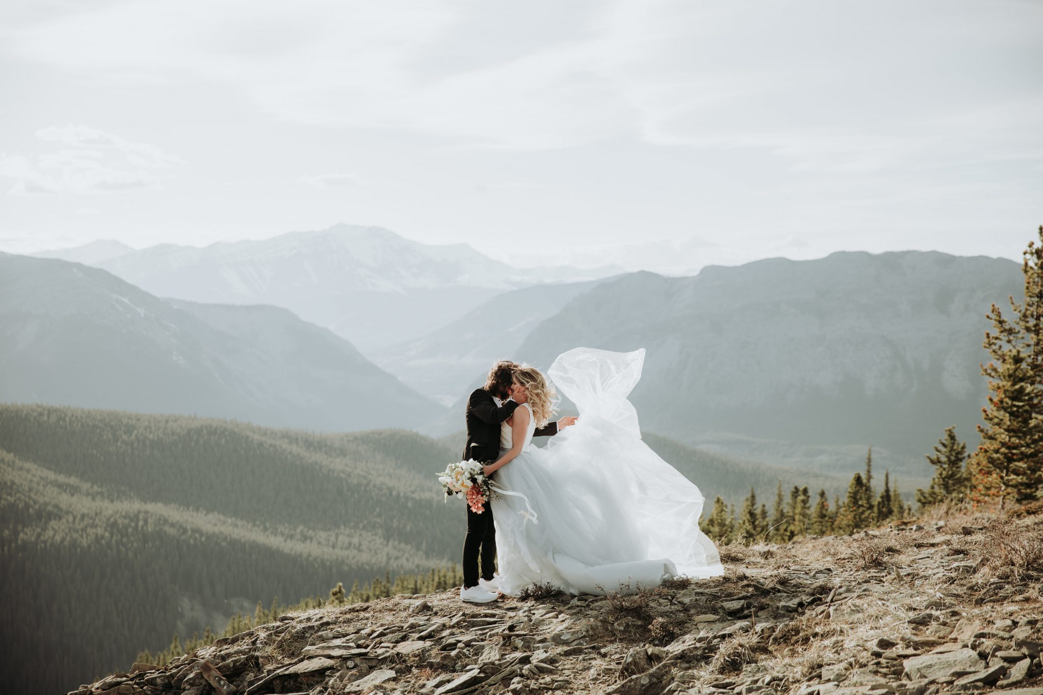 Mountainous Adventure Session featuring Contemporary Attire & Alberta Views Featured on Bronte Bridë with Romantic Wedding Dress