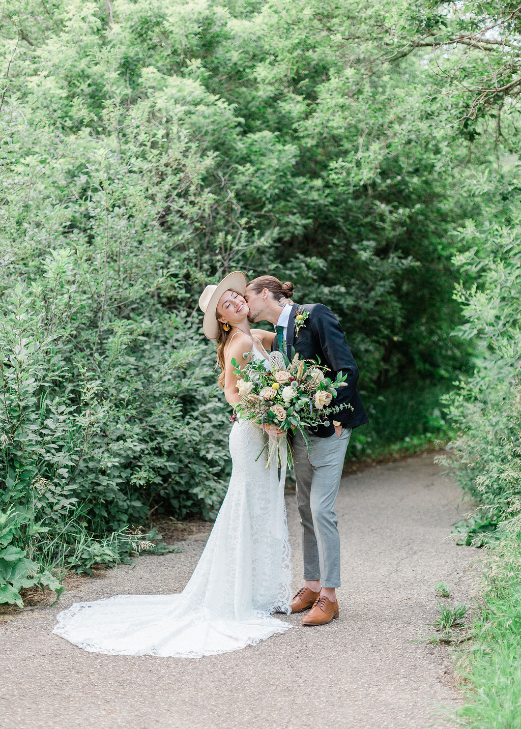 Intimate Wild Flower Wedding - wedding bouquet, bride and groom