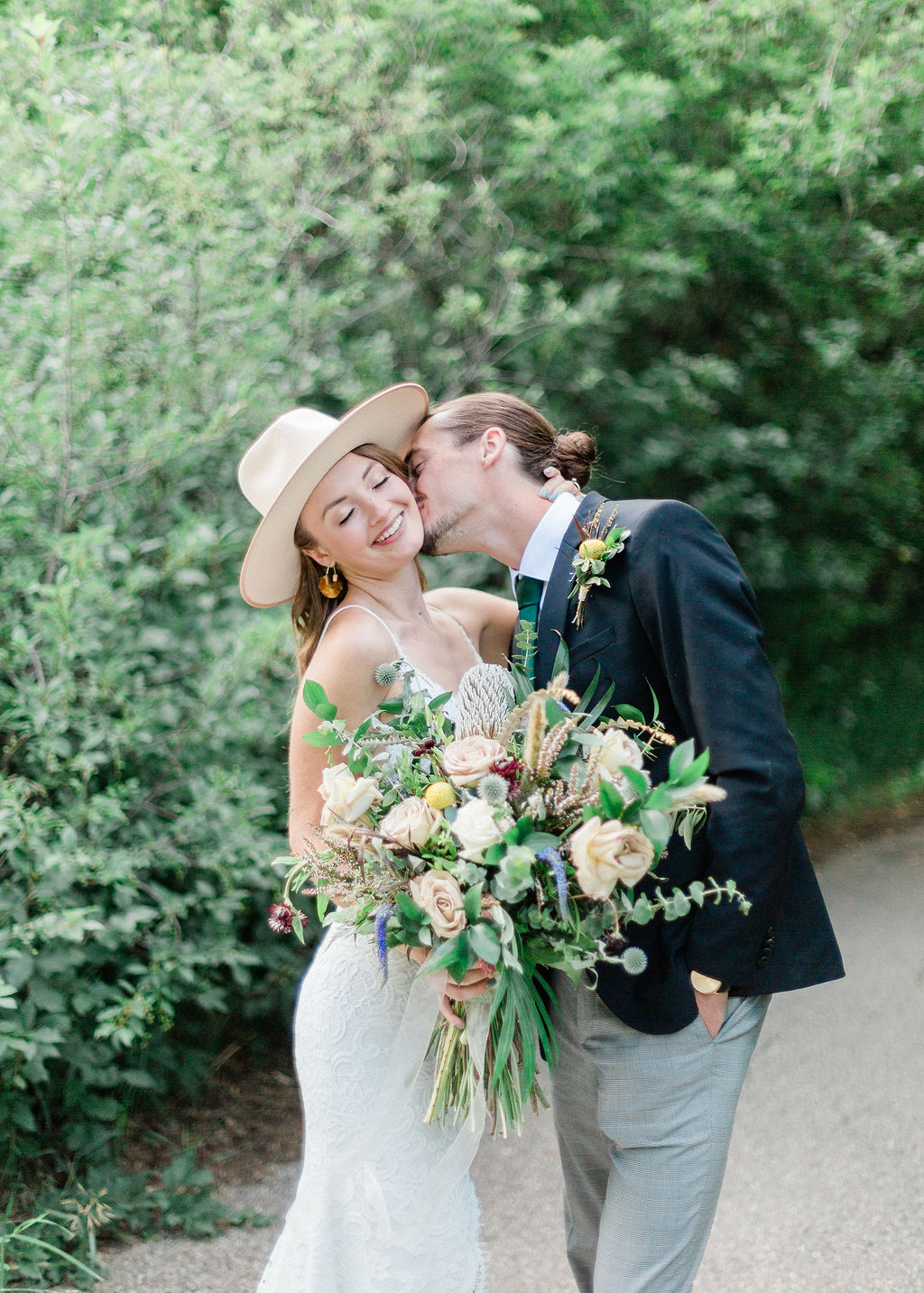 Intimate Wild Flower Wedding - wedding bouquet, bride and groom
