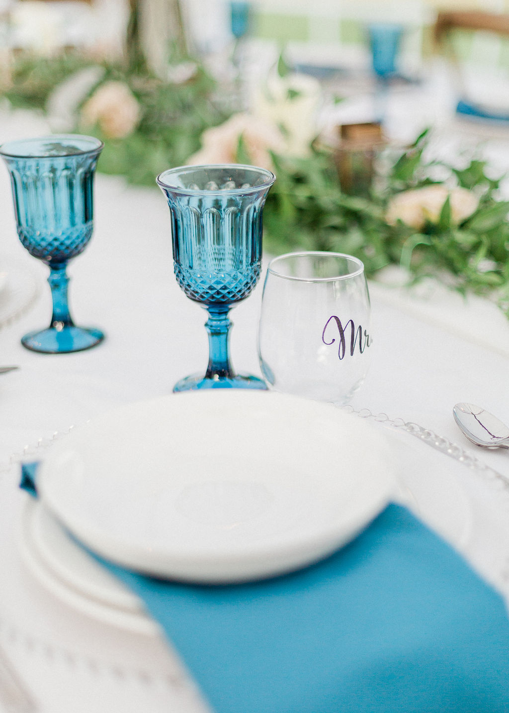 Intimate wild flower wedding - tablescape, blue details, floral arrangement