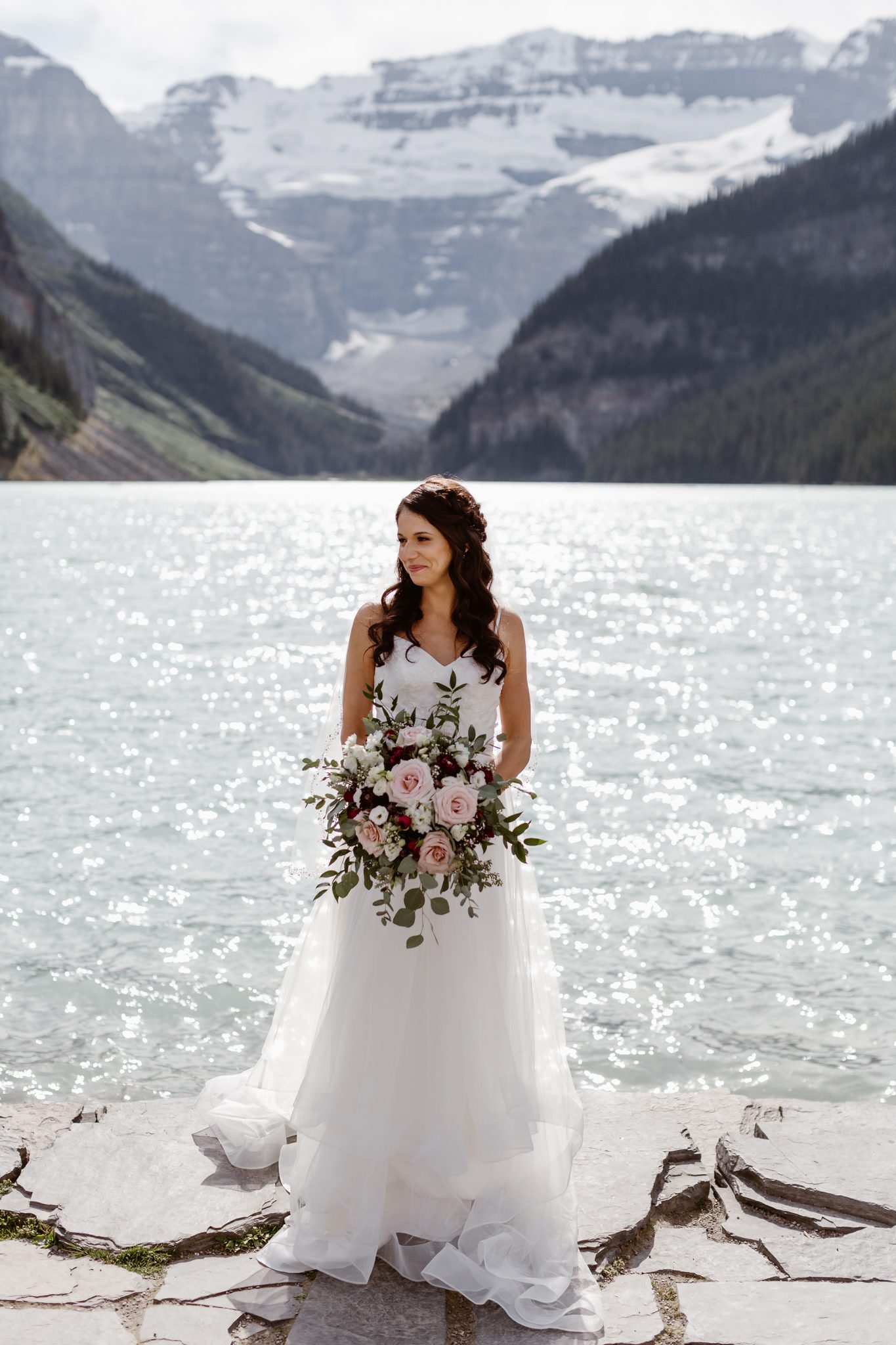This Couple Ended up Loving Their Downsized Wedding at Fairmont Lake Louise - bridal style, mountain wedding, burgundy bouquet