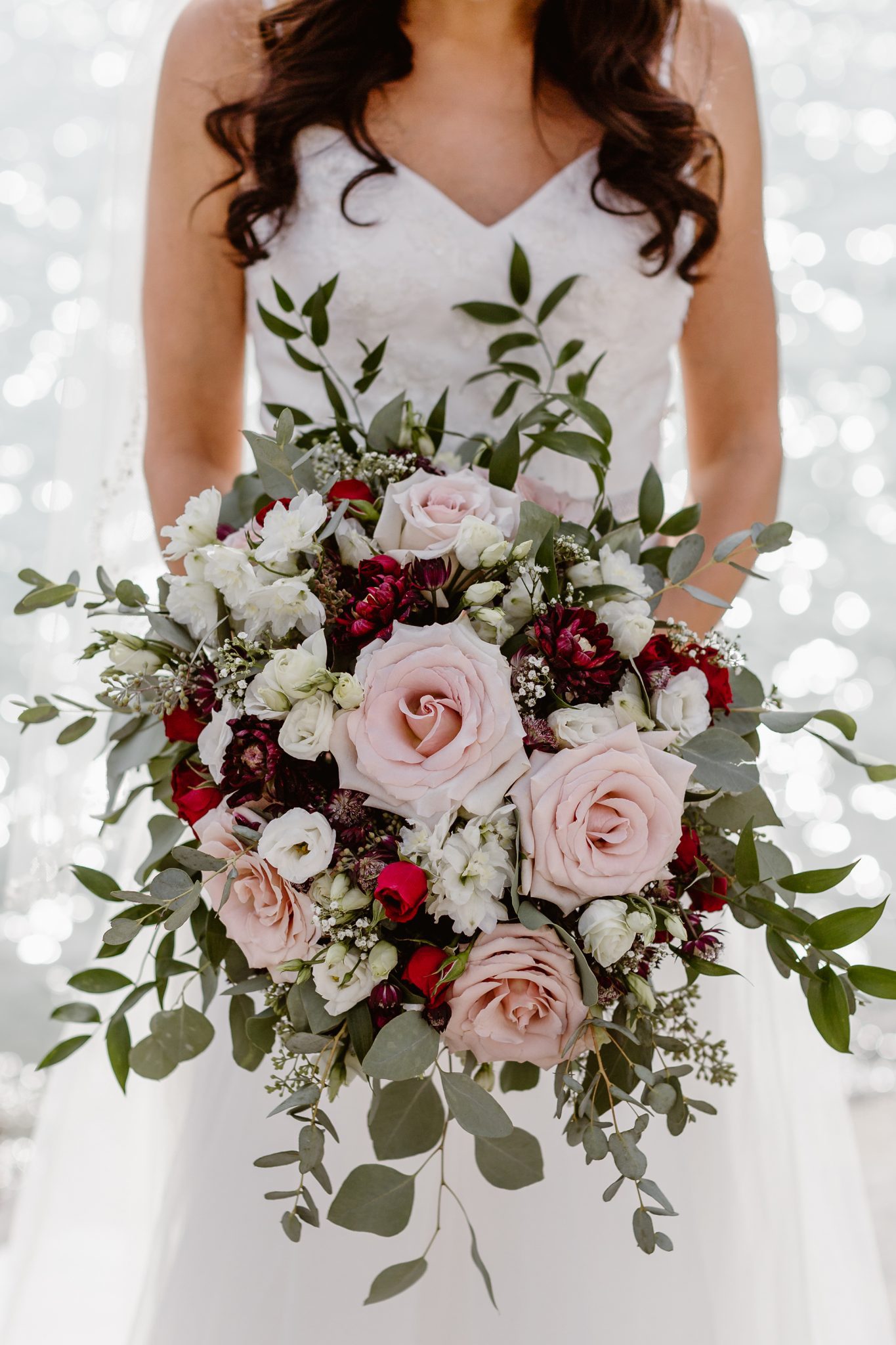 This Couple Ended up Loving Their Downsized Wedding at Fairmont Lake Louise - bridal bouquet, burgundy flowers, bridal style