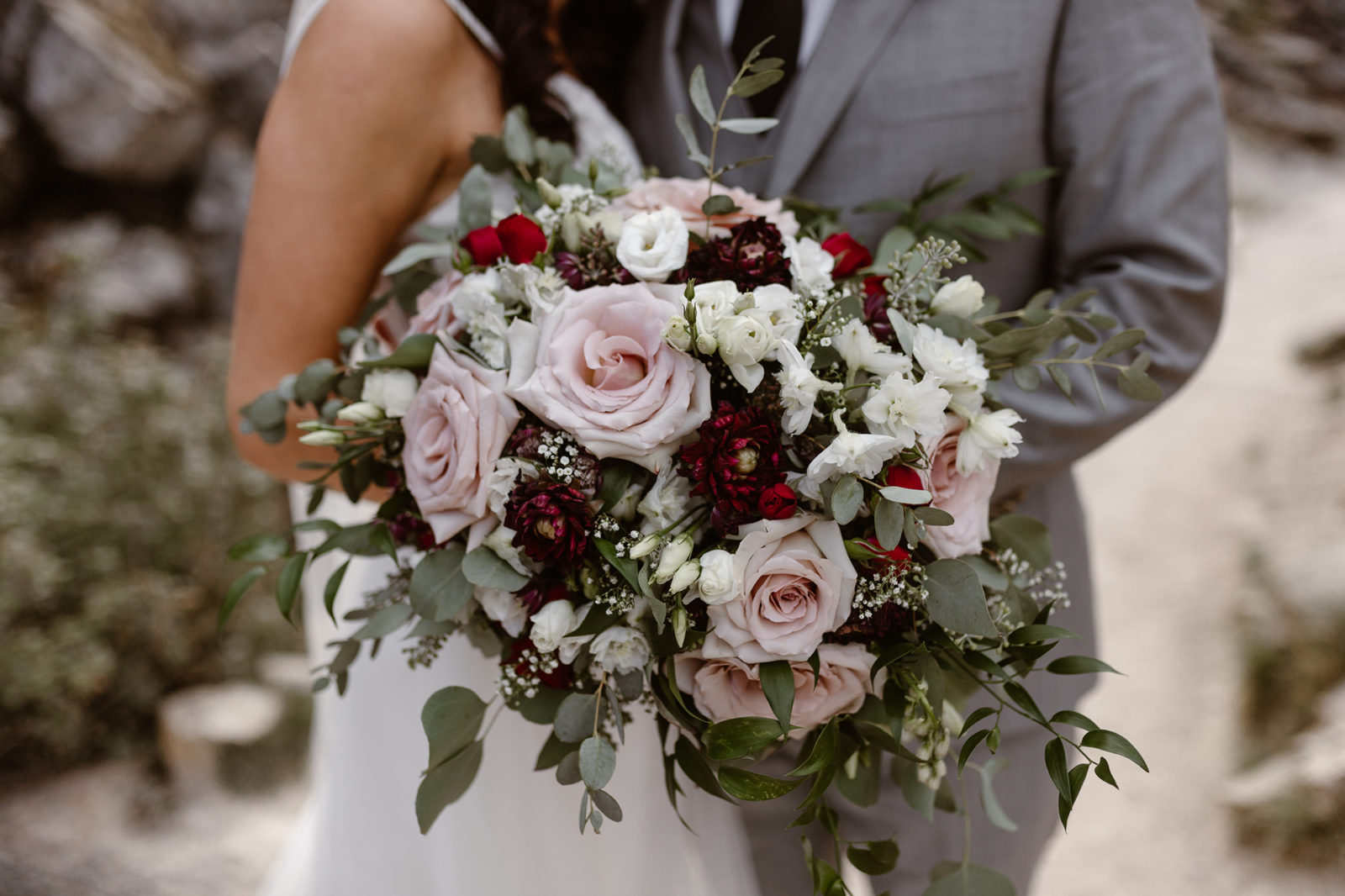This Couple Ended up Loving Their Downsized Wedding at Fairmont Lake Louise - bridal bouquet, blush roses