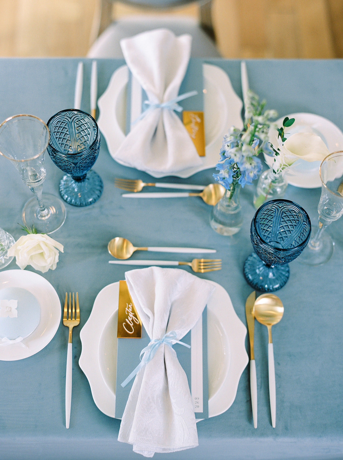 Craving a Paris Getaway? This Parisian Wedding Inspiration Will Transport You To a Quaint Town In France Featured by Brontë Bride, blue tablescape, wedding place settings