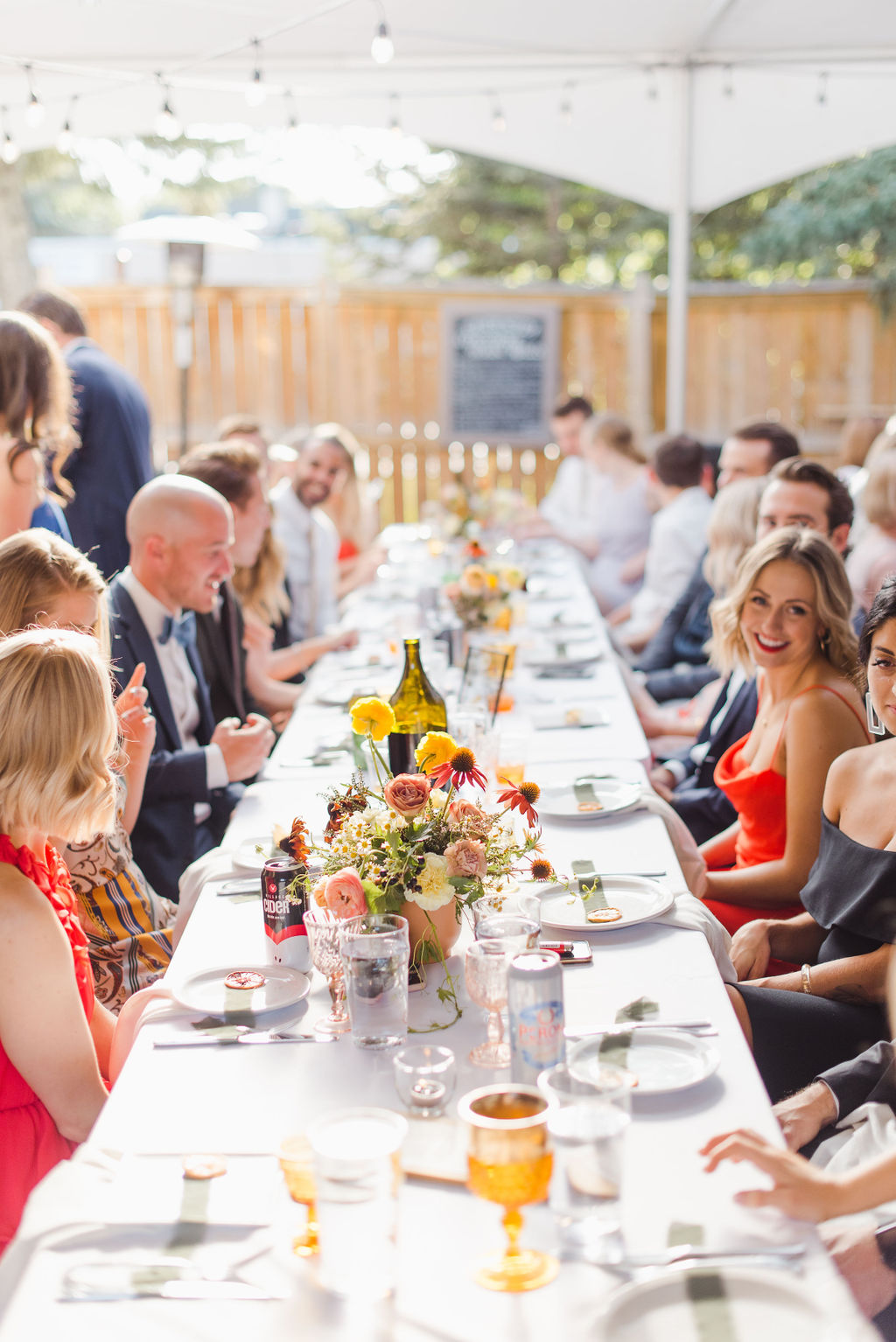 Calgary wedding guests gathered around an Italian inspired table for this summer wedding