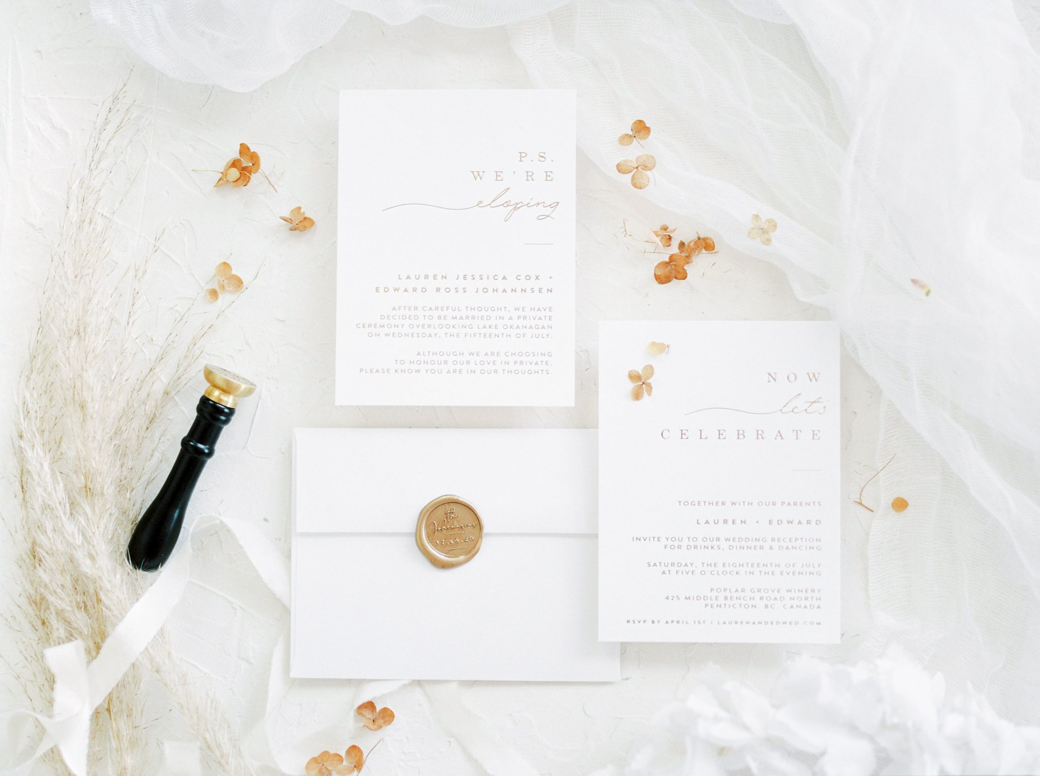 White and gold wedding stationery styled against a white backdrop