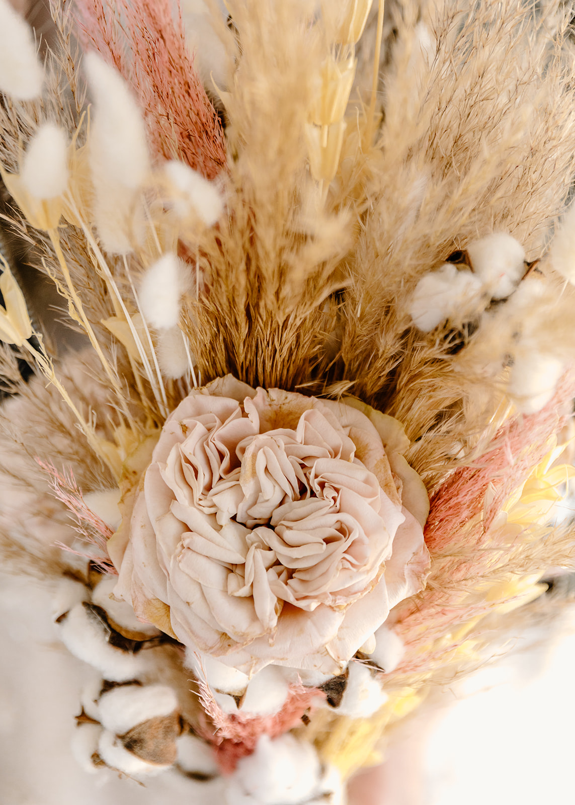A mix of dried and fresh florals for elopement inspiration with peach and mustard hues
