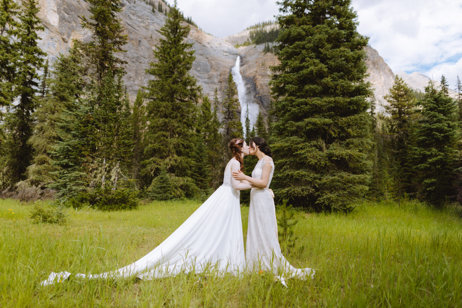Newly weds share their first kiss in front of Takakkaw Falls for this Elopement in Yoho National Park