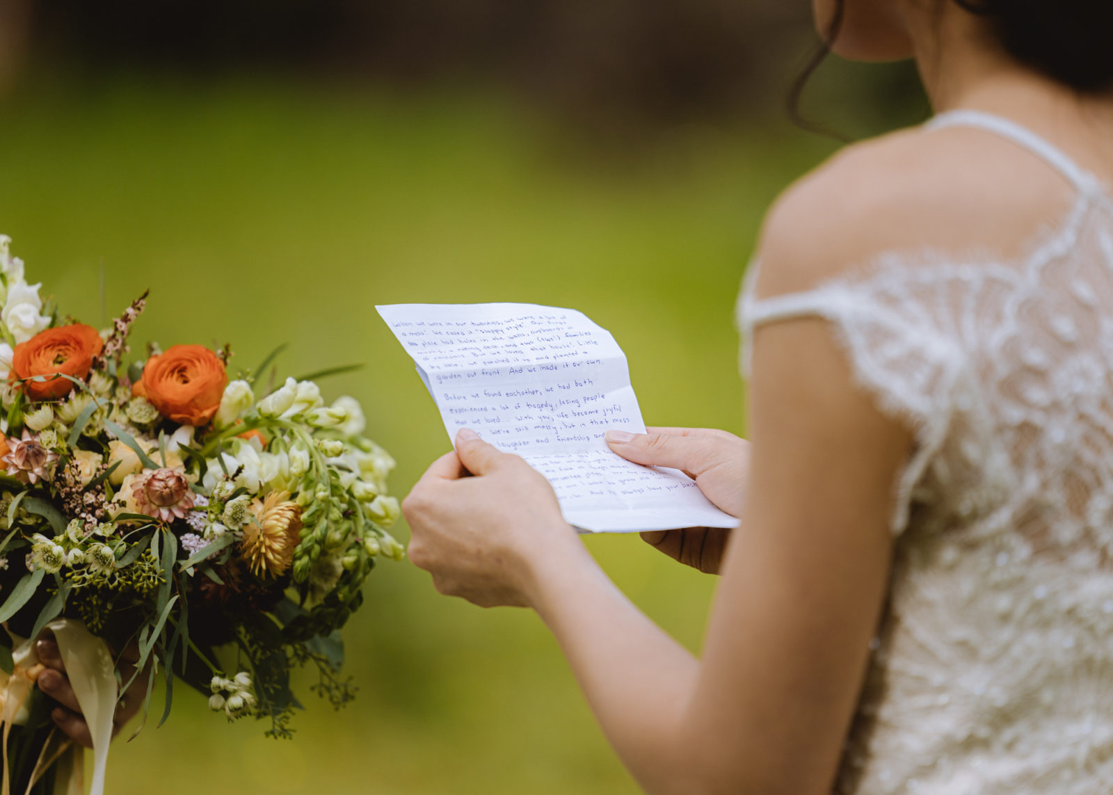 A bride holds a had written letter