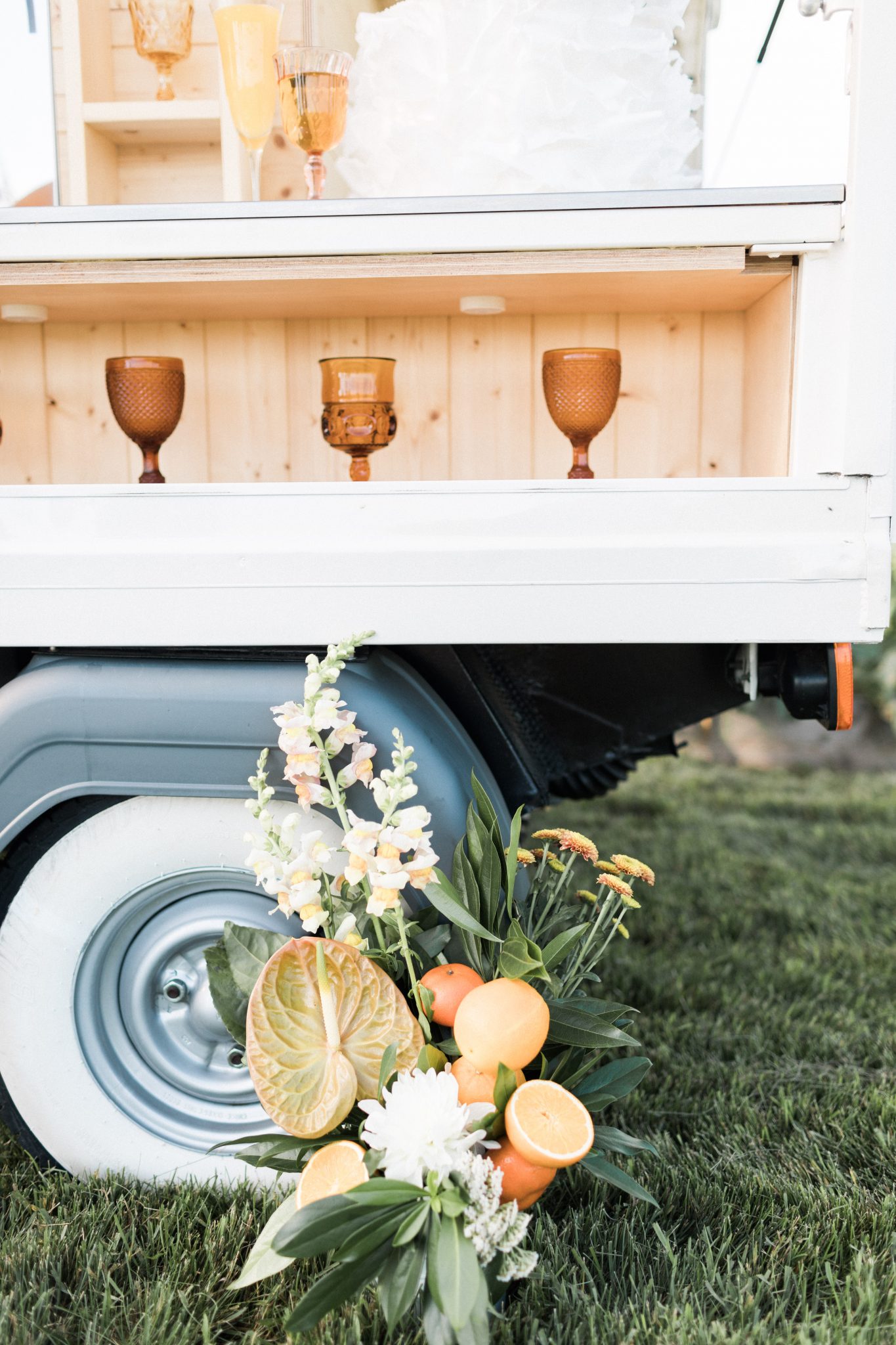 Mobile bar cart decorated with orange and tangerine accents