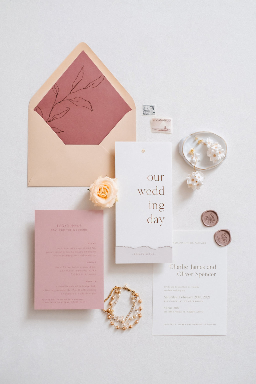 Contemporary wedding stationery featuring dusty rose, pink, sand and light orange wedding colours