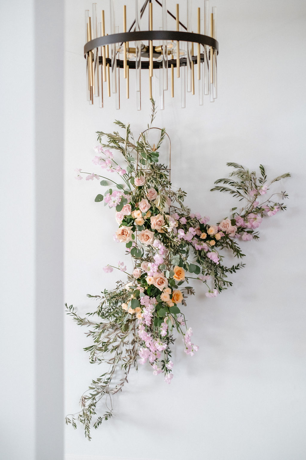 Contemporary floral design by Creative Edge Flowers featuring pink, orange and lilac blooms