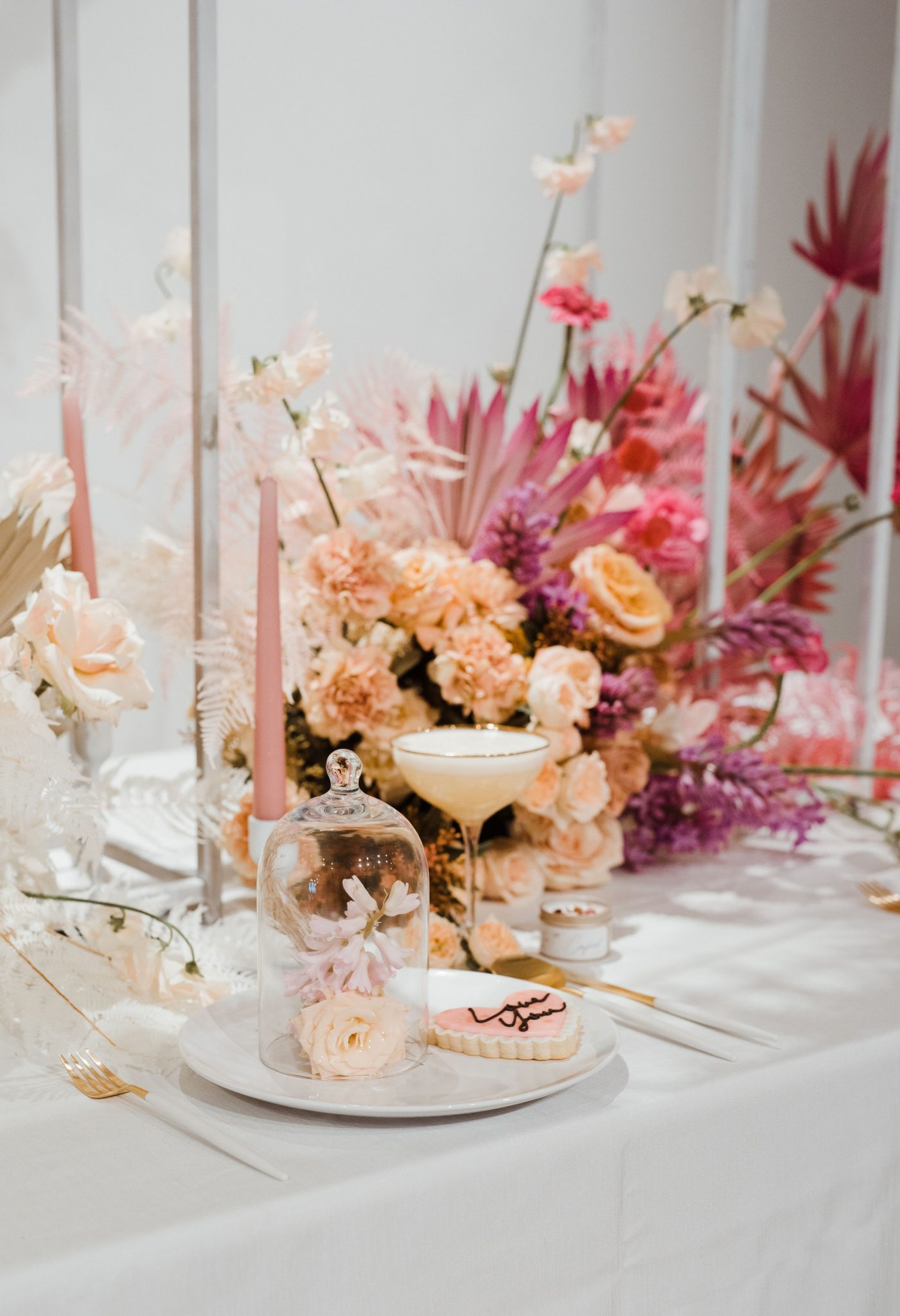 Pink ombre florals on a wedding tablescape for pink wedding inspiration