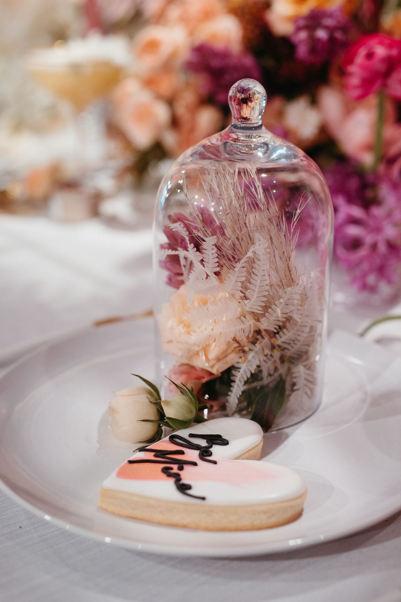 Pink ombre florals and heart shaped cookies for wedding decor inspiration