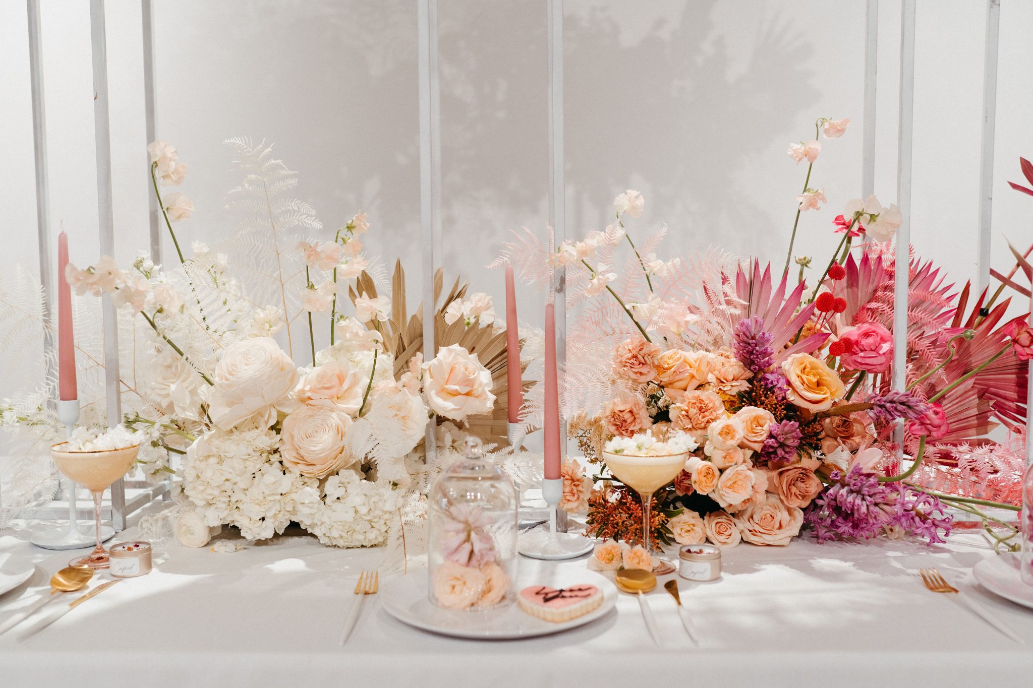 Wedding decor inspiration featuring ombre pink and white flowers 