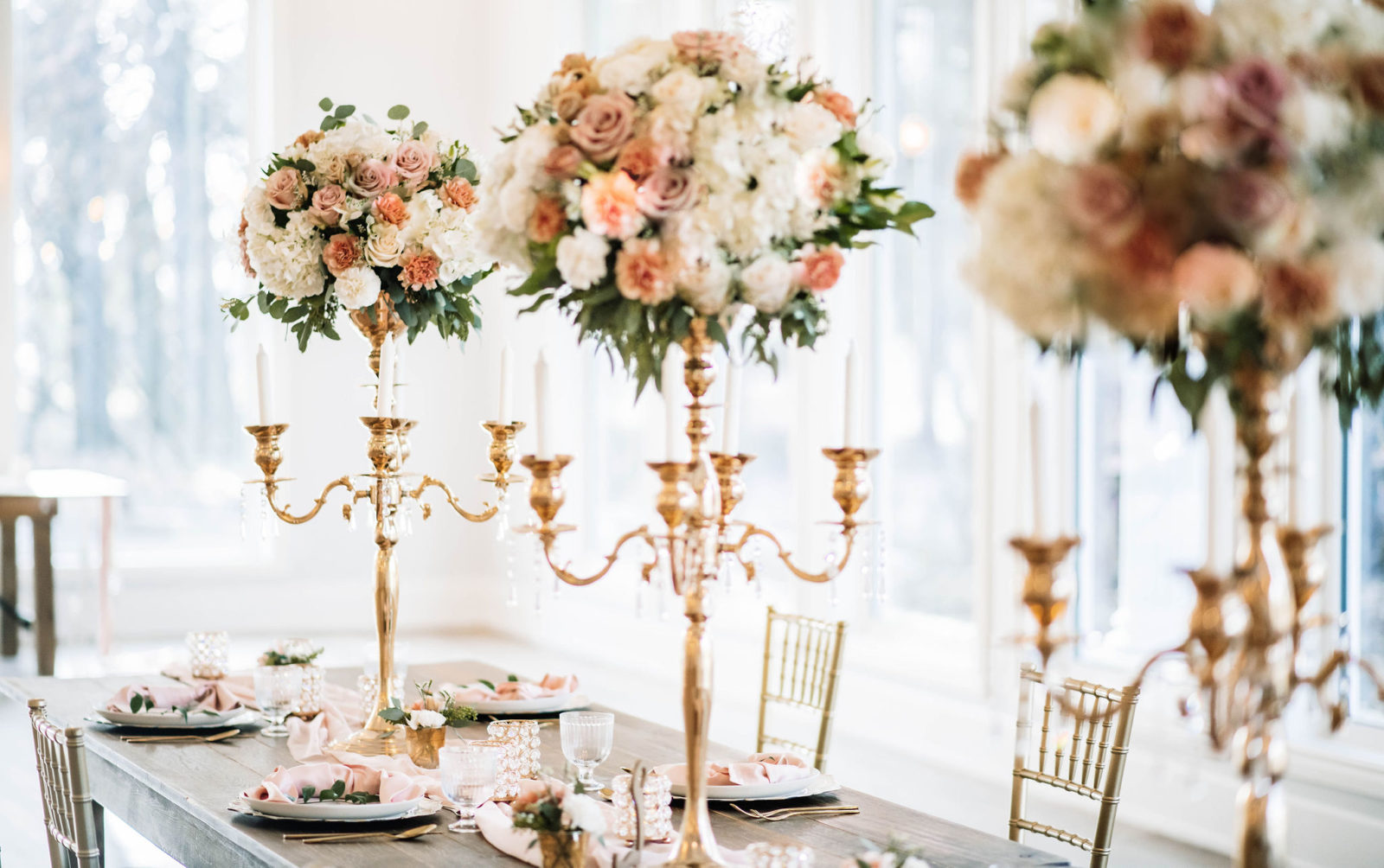 Enchanting ballroom wedding decor inspiration with gold candelabras with stunning floral arrangments