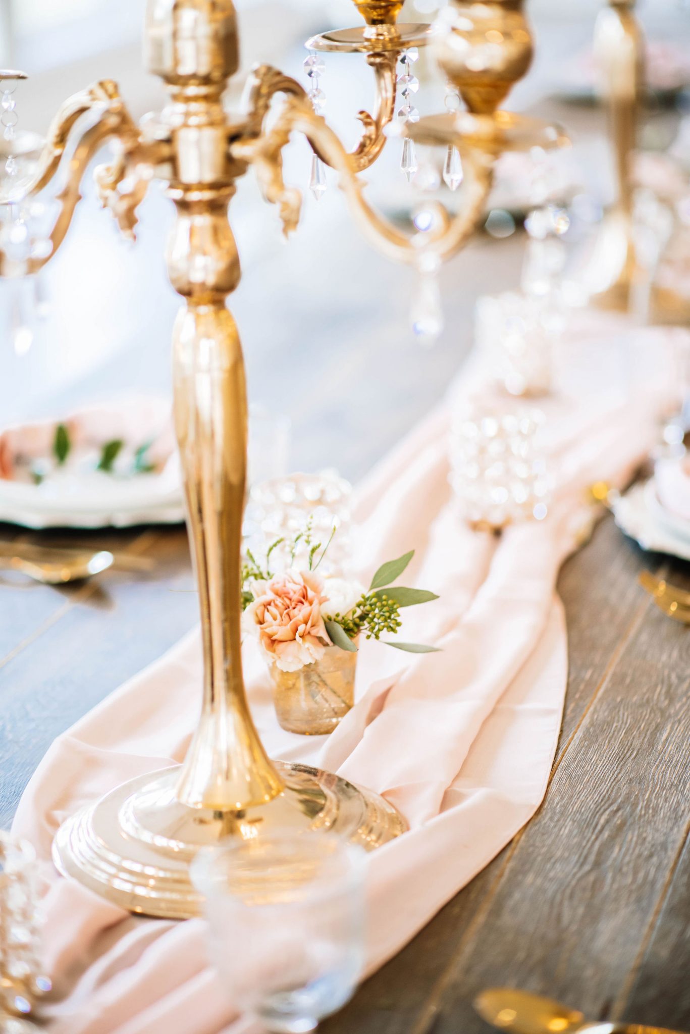 Enchanting ballroom wedding decor inspiration with golden candelabras, pink silk and crystal accents