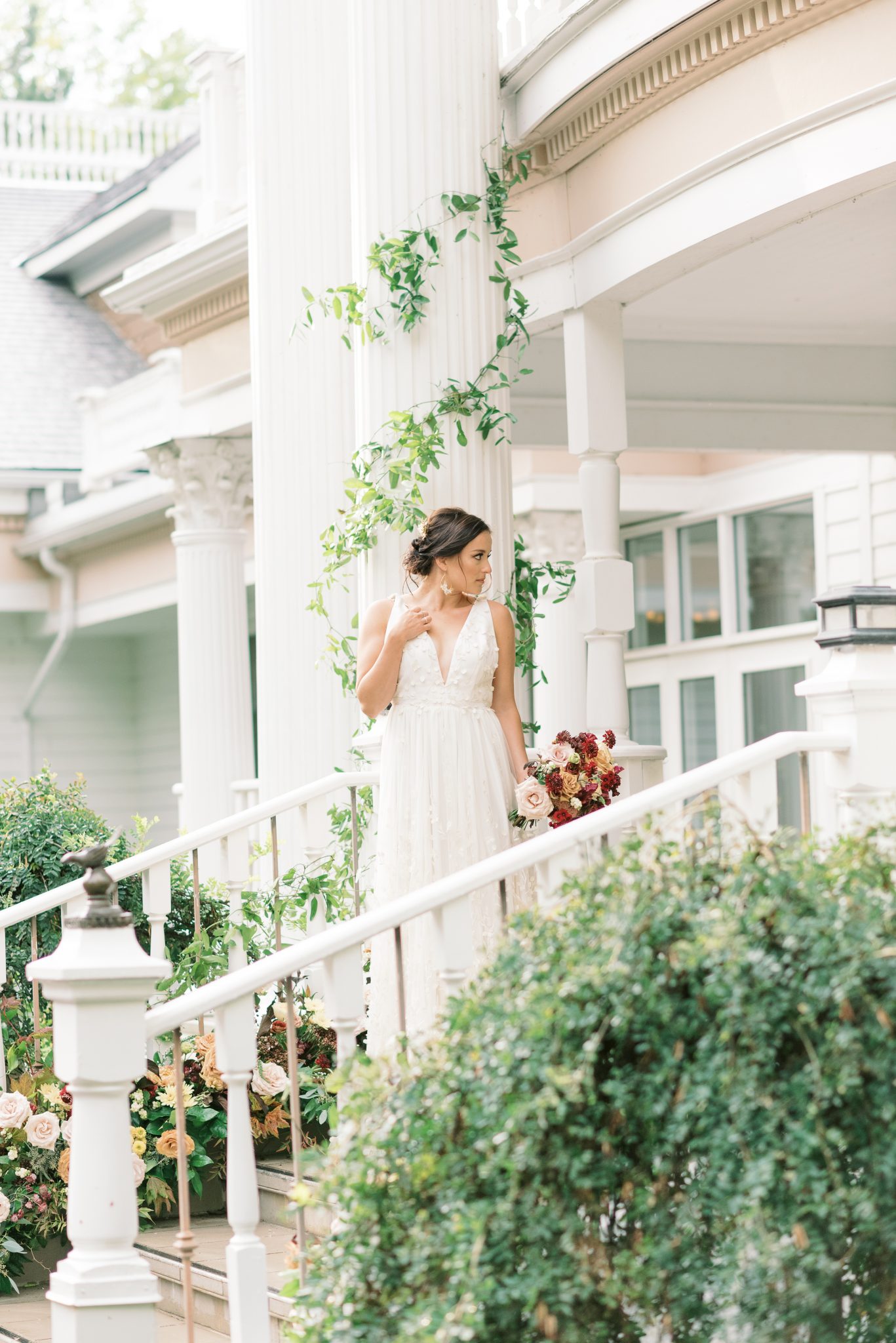 Enchanting bride poses on the steps of the Norland Historic Estate