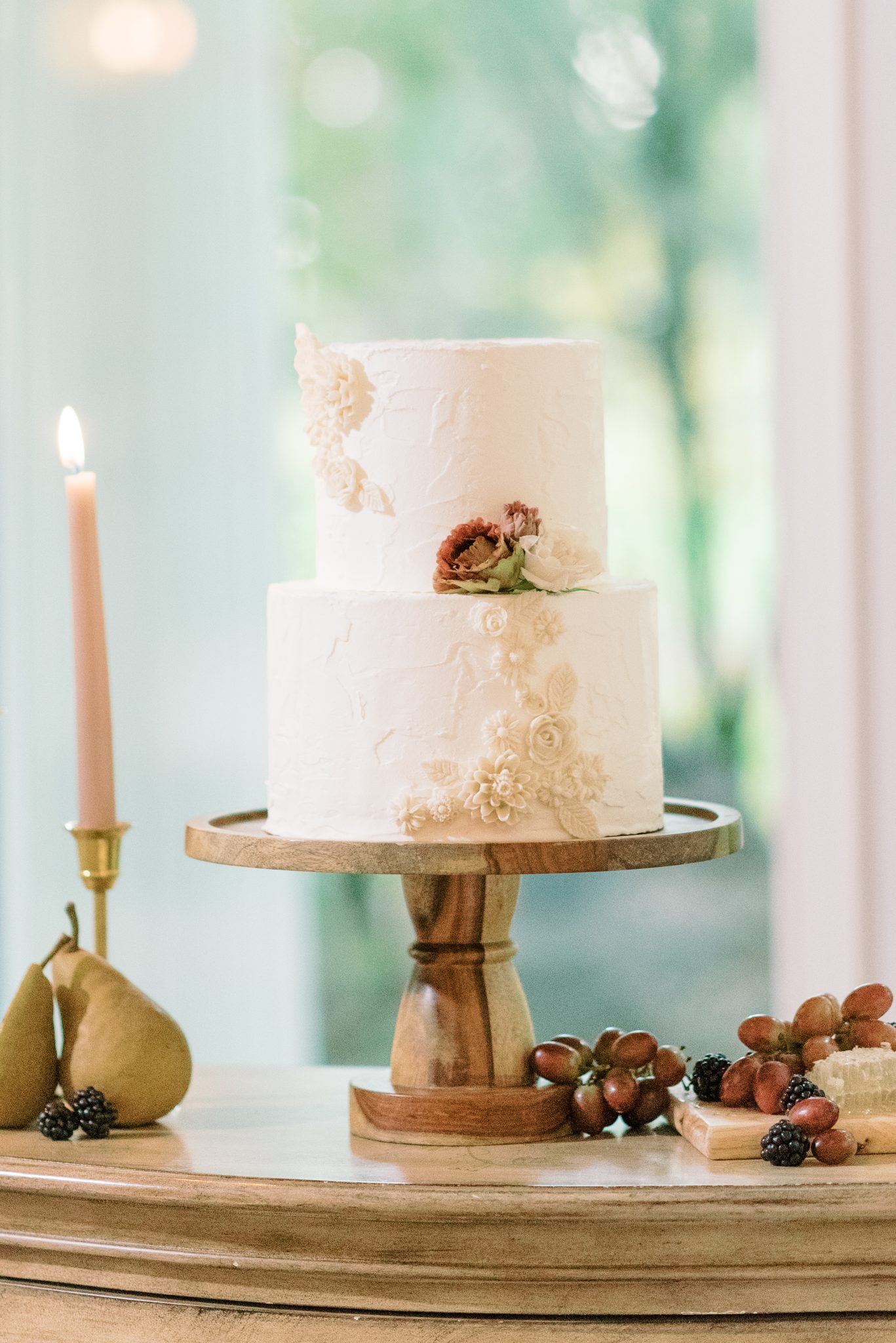 Elegant and vintage styled white wedding cake by Bake My Day