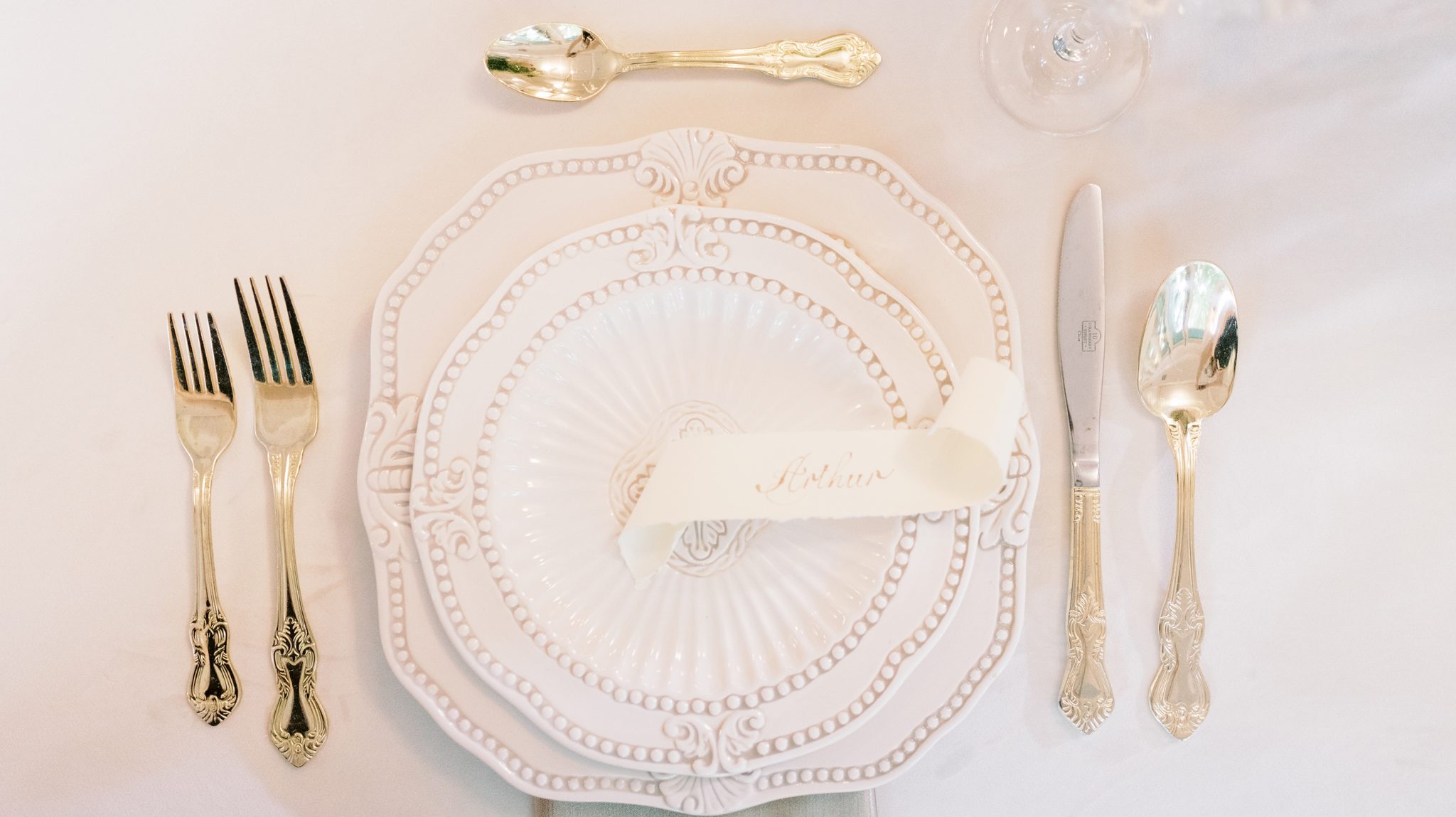 Place settings for an elegant wedding with white and silver 