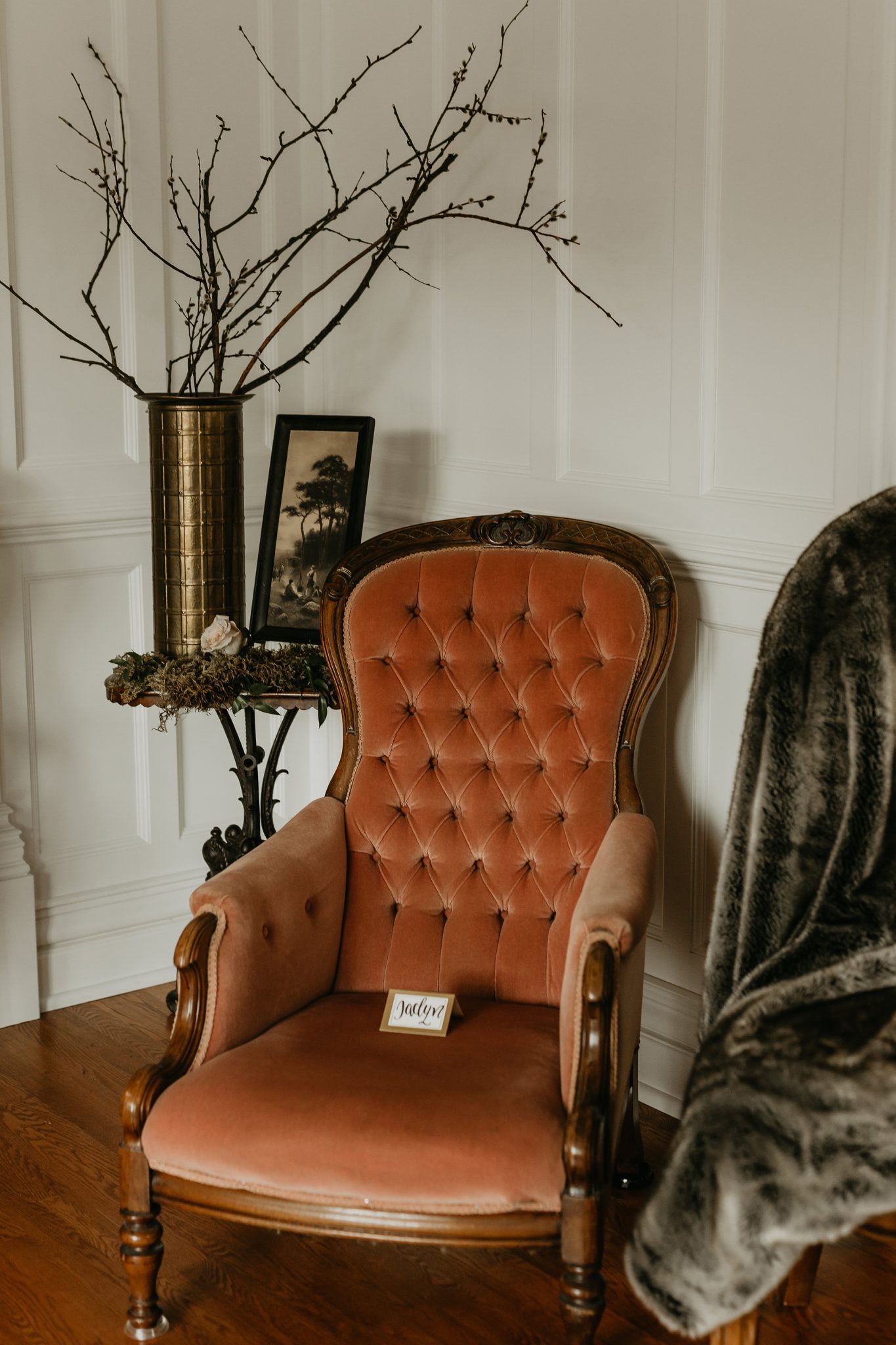 Orange high backed vintage armchair as living room minimony decor