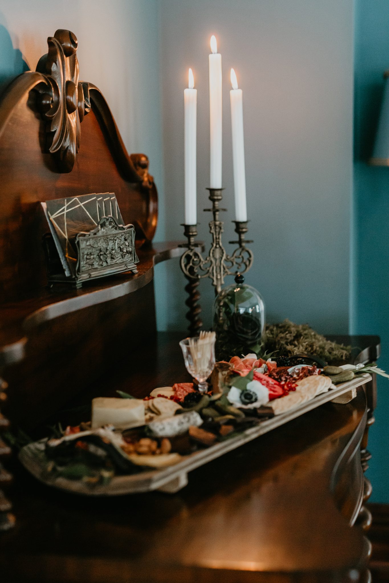 Charcuterie board and a candelabra for this moody October wedding
