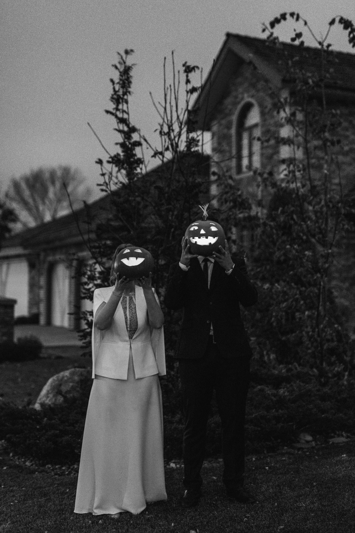 Bride and Groom pose with lanterns on their wedding day 