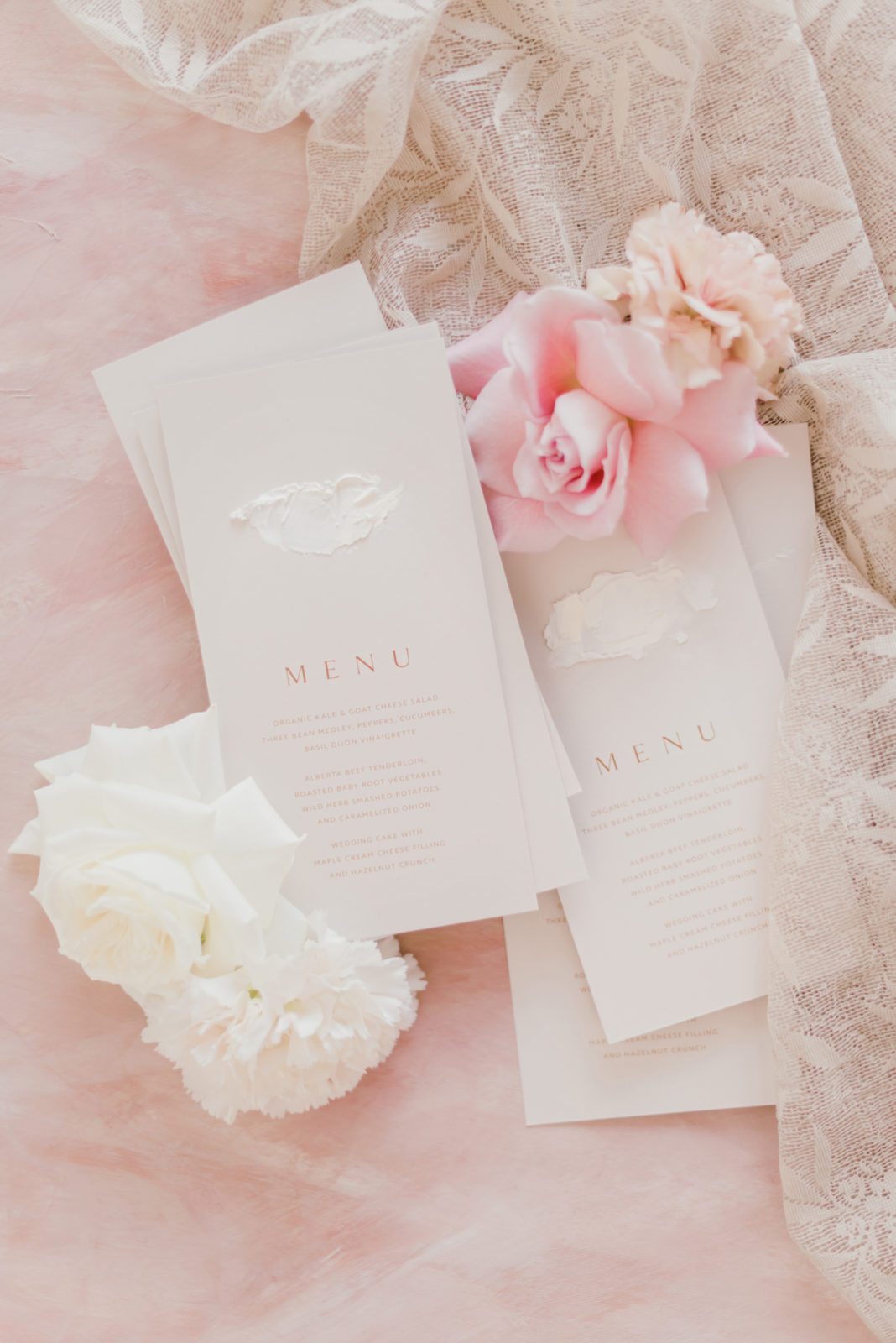 Delicate white feminine wedding stationery inspiration with pink flowers
