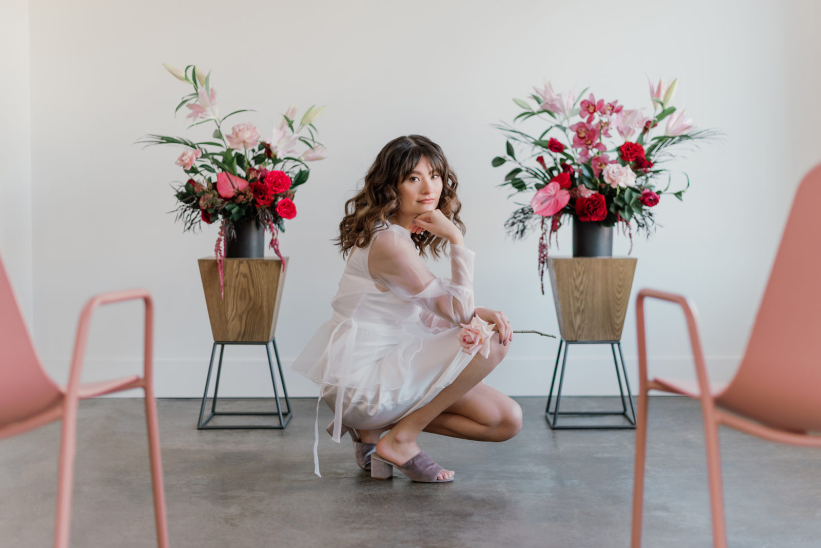 Modern microwedding inspiration with pink chairs and pink and white florals
