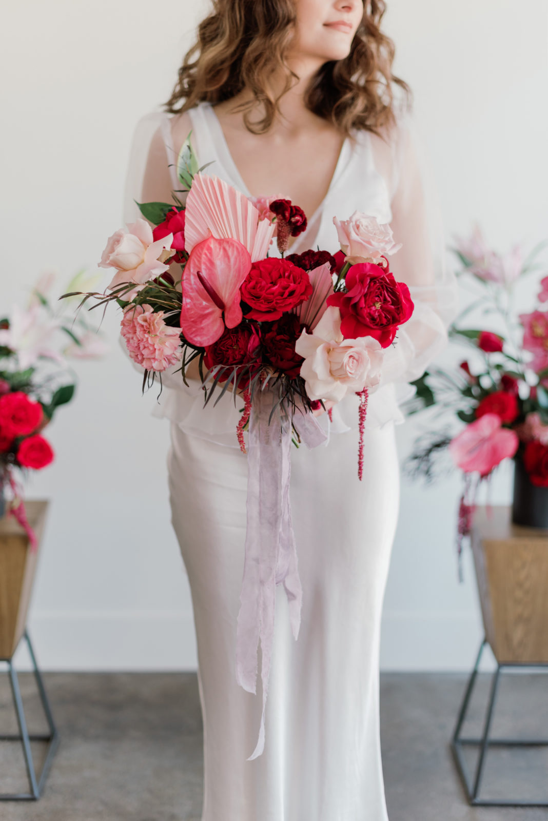 Vibrant pink and berry tropical bridal bouquet for a modern bride