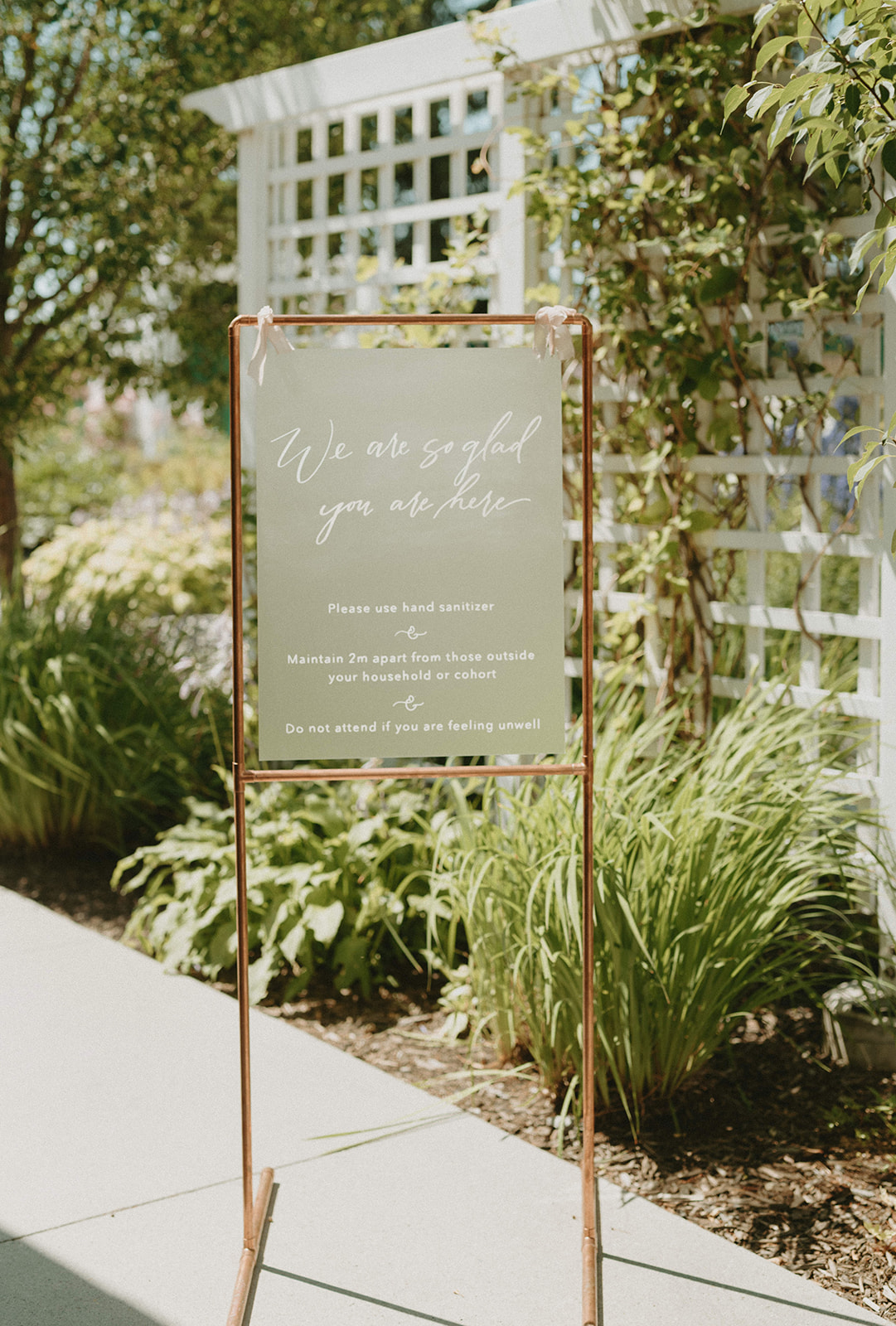 Modern copper and olive welcome to our wedding sign for an outdoor wedding ceremony