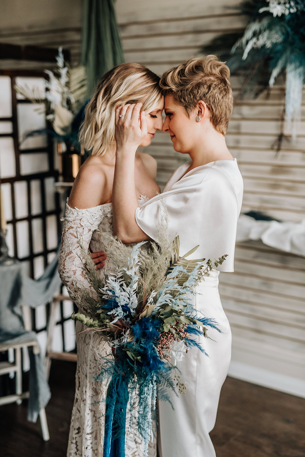 Brides share an intimate moment for this chic and bohemian elopement inspiration shoot