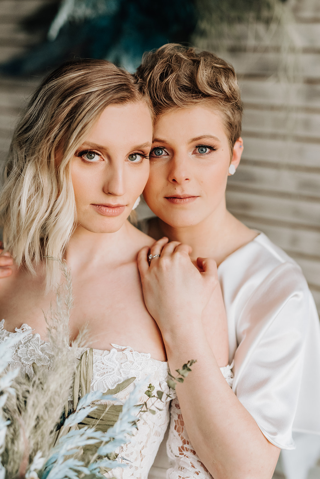Brides pose together for their bohemian intimate elopement ceremony