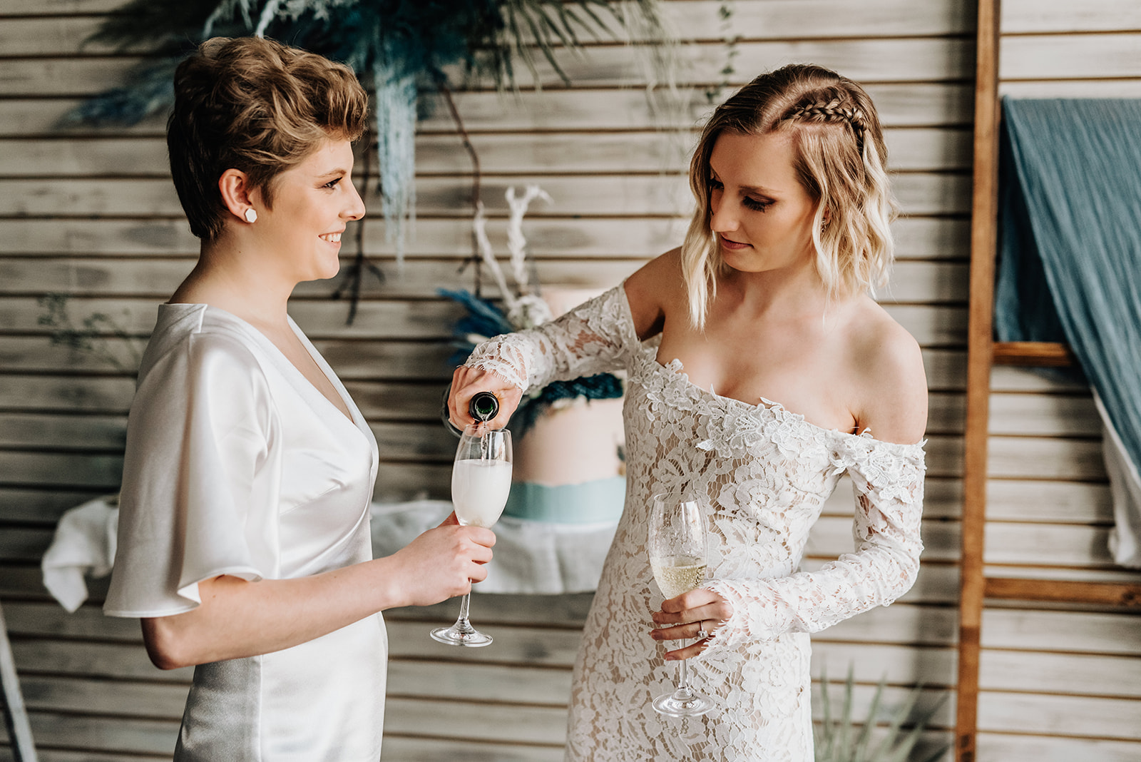 Brides share champagne for this intimate bohemian elopement