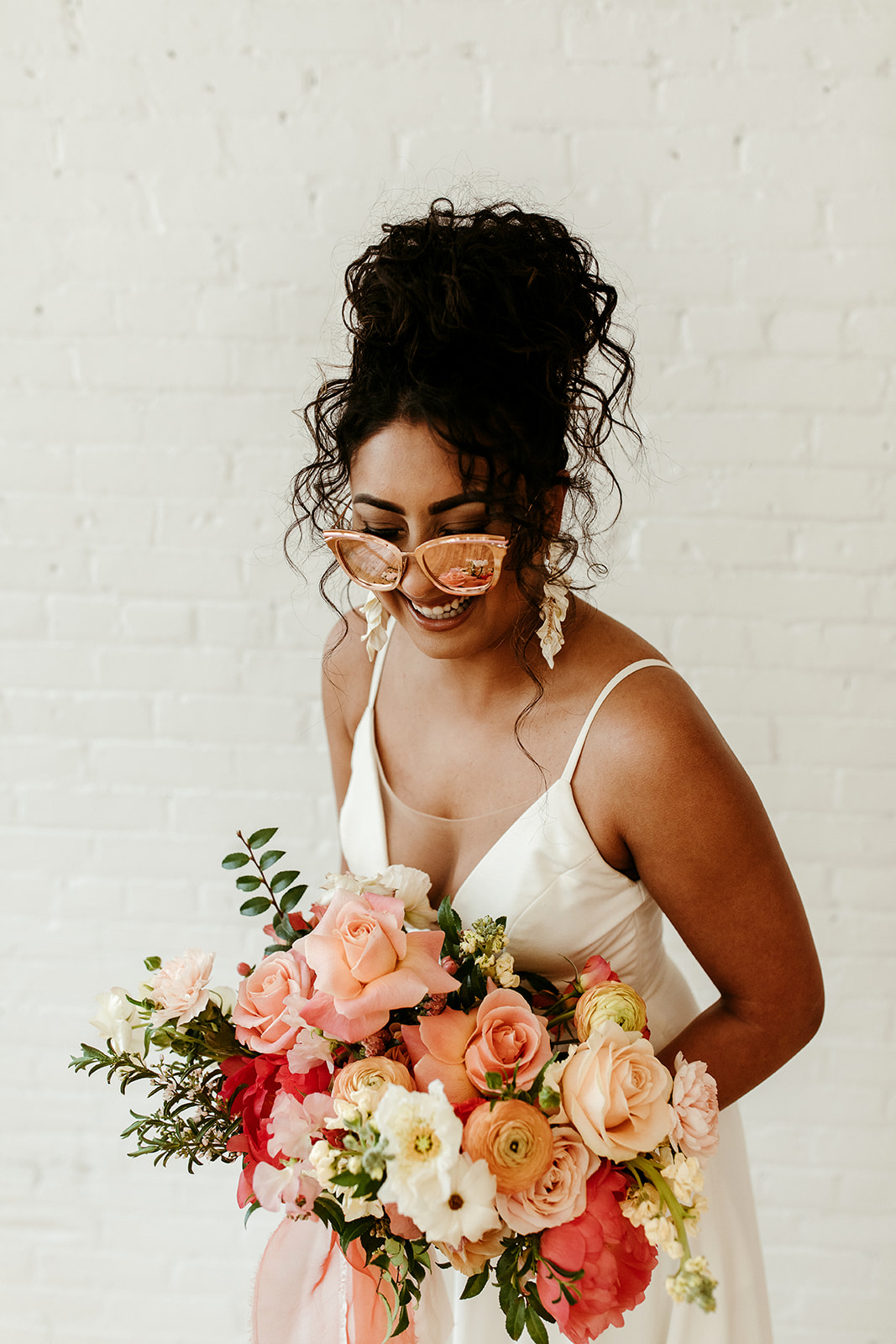 Boho Bridal Style with a bold updo, sunglasses and florals with a citrus palette