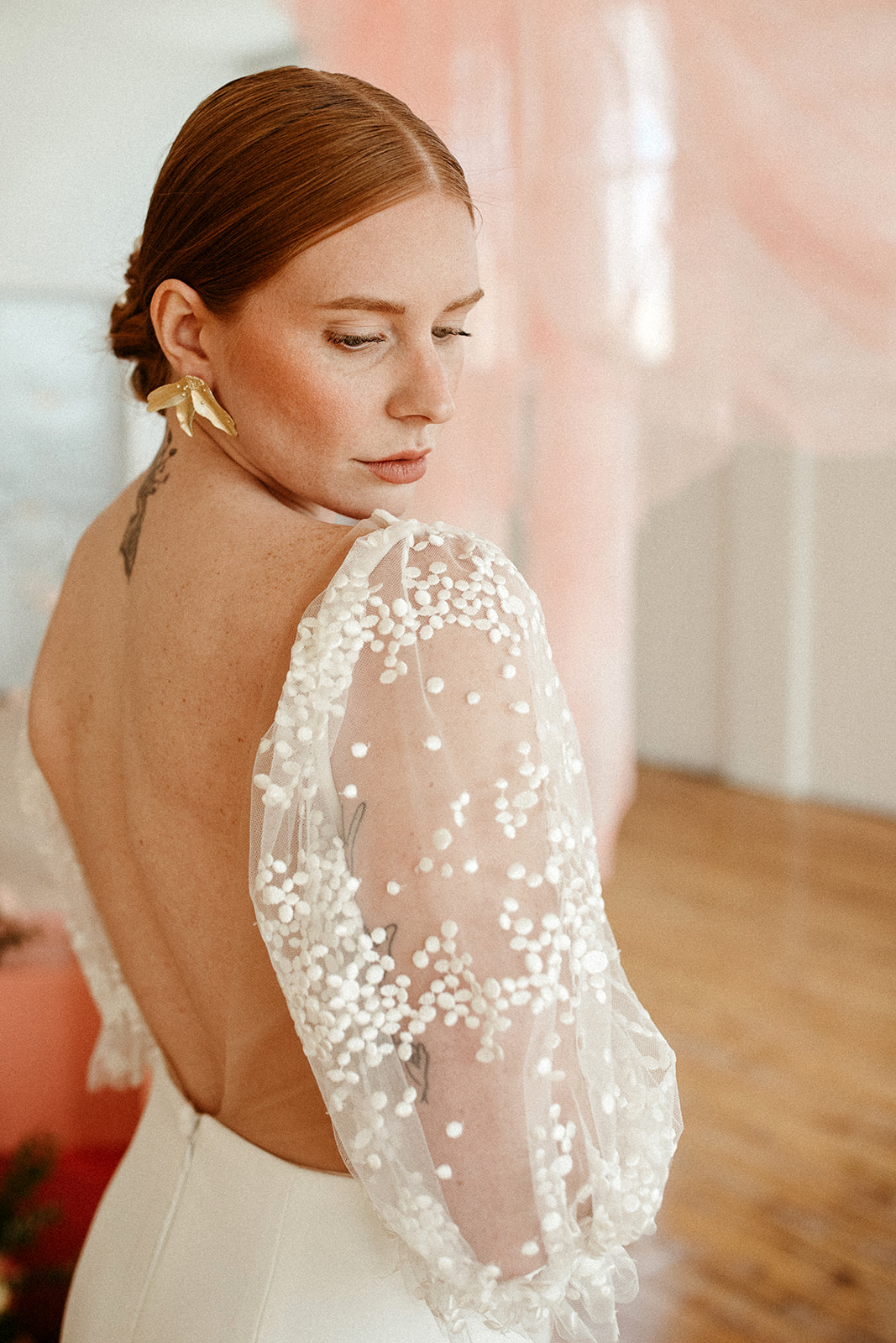 Detailed sleeves on a boho bridal gown from Delica Bridal in Edmonton Alberta