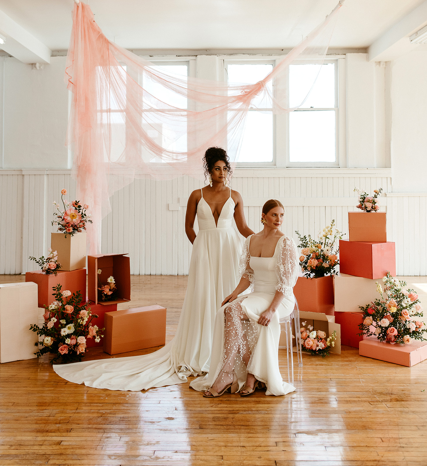 Boho Bridal Style with citrus details and pink hanging fabric in a downtown Edmonton loft