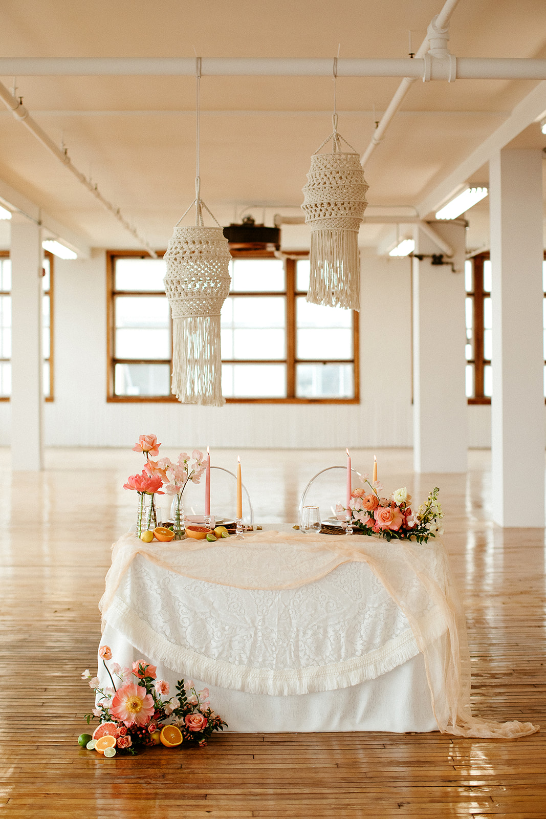 Macrame hanging above a bold citrus tablescape for this unique diy ceremony design