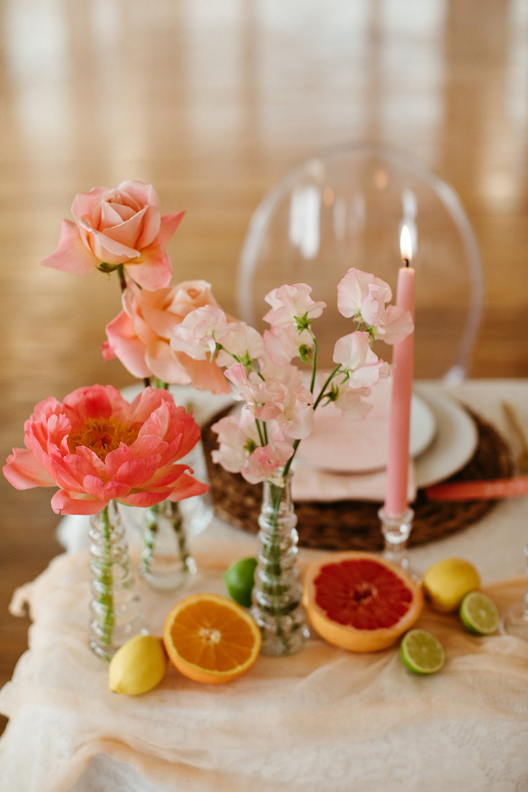 Peach and pink florals for a boho tablescape filled with bold citrus inspiration