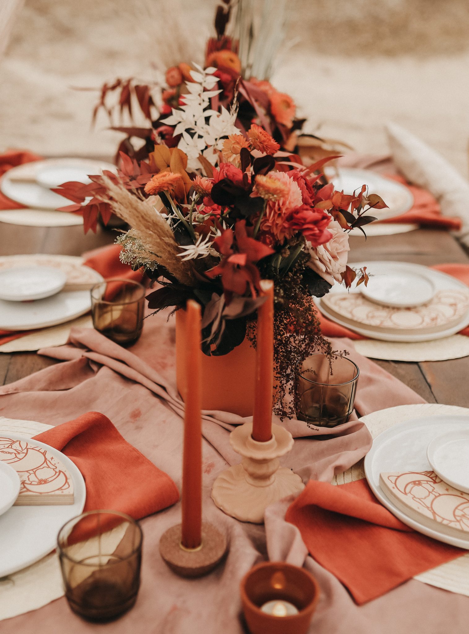 Moroccan inspired tablescape for a boho elopement with terracotta accents and boho florals