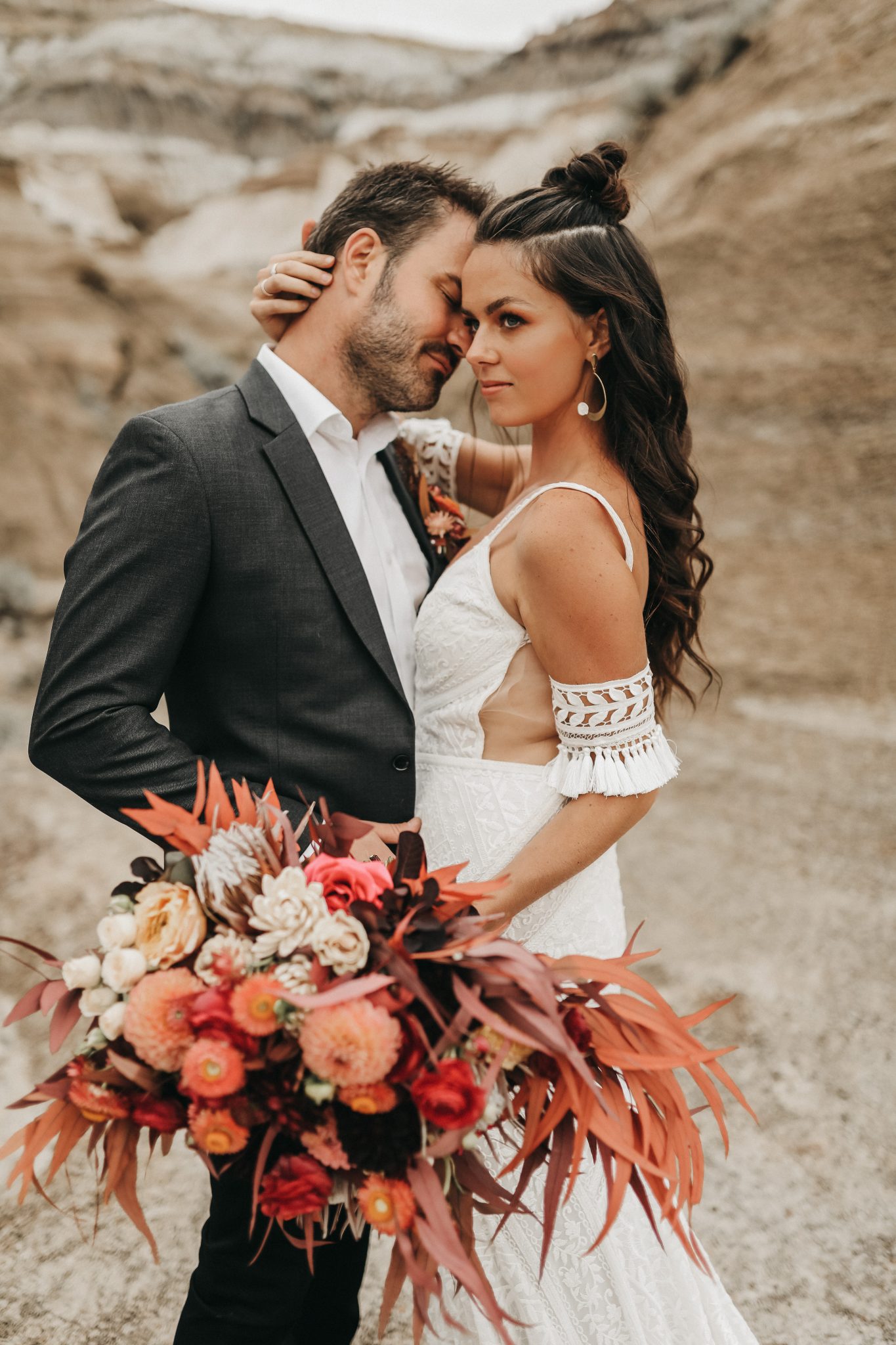Wedding attire for Moroccan Elopement Inspiration with boho lace bridal cuffs and a terracotta palette