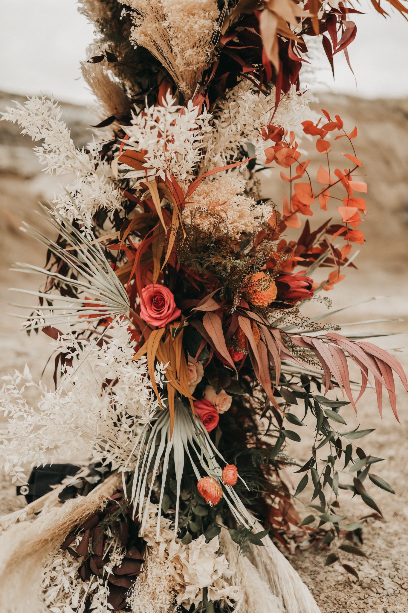 Boho wedding arch flowers with terracotta hues for a Moroccan Inspired Elopement