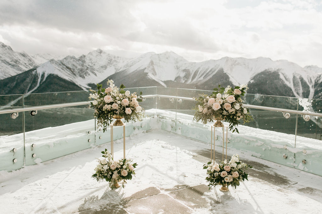 Elegant and upscale ceremony decor for a wedding at Sky Bistro in Banff Alberta