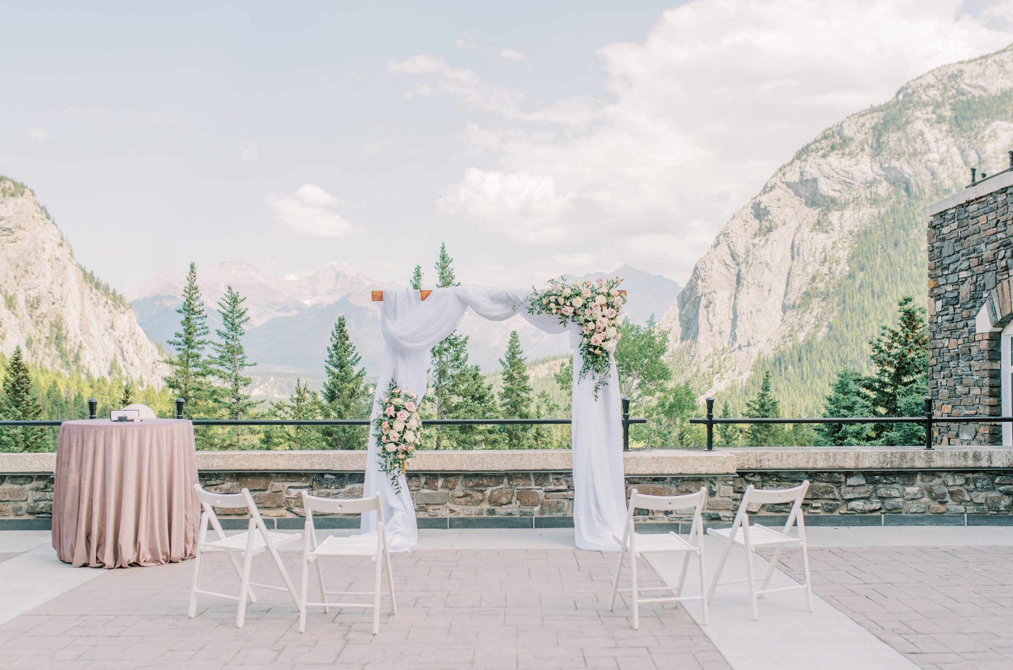 Feminine and airy wedding decor inspiration on the patio at the Fairmont Banff Springs Hotel in Banff Alberta
