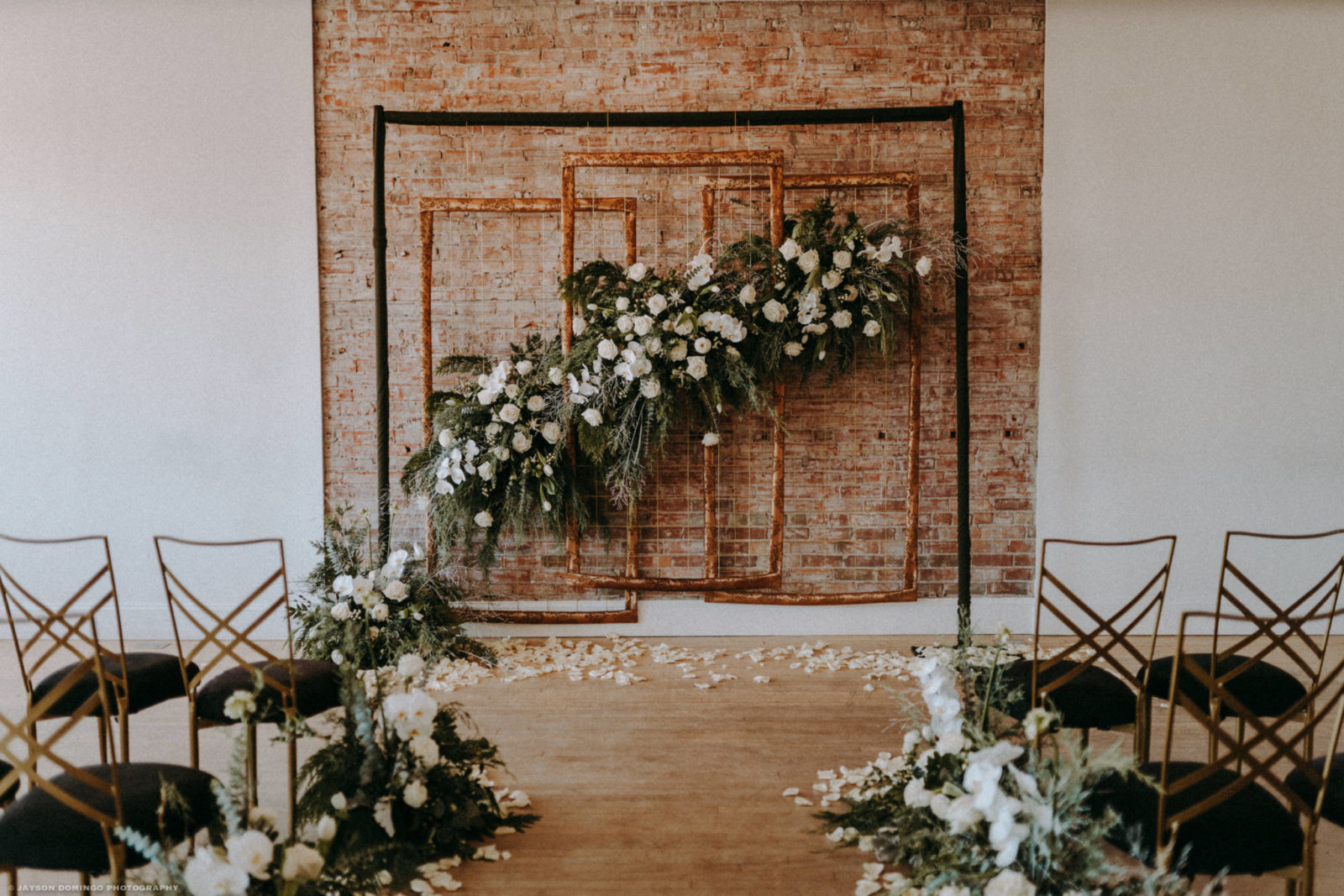 Industrial wedding ceremony design inspiration with hanging panels and greenery in Calgary Alberta 