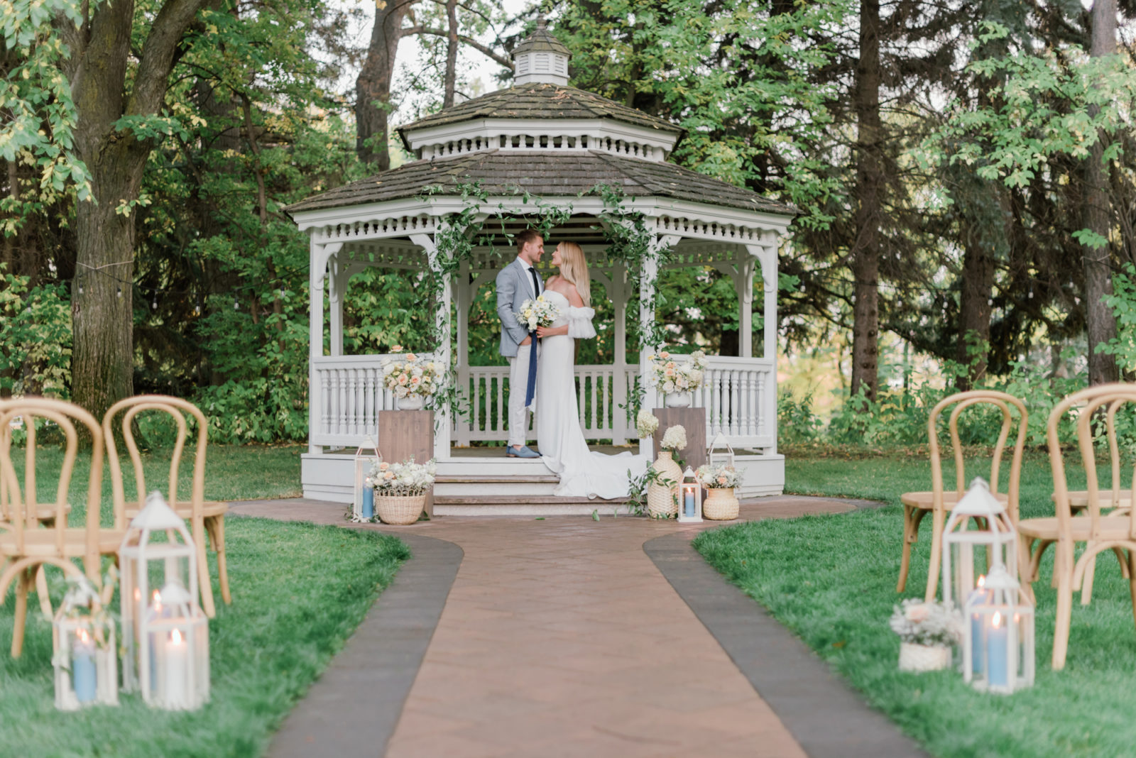 Old world inspired wedding ceremony at the gazebo at the Norland Historic Estate Venue in Lethbridge Alberta