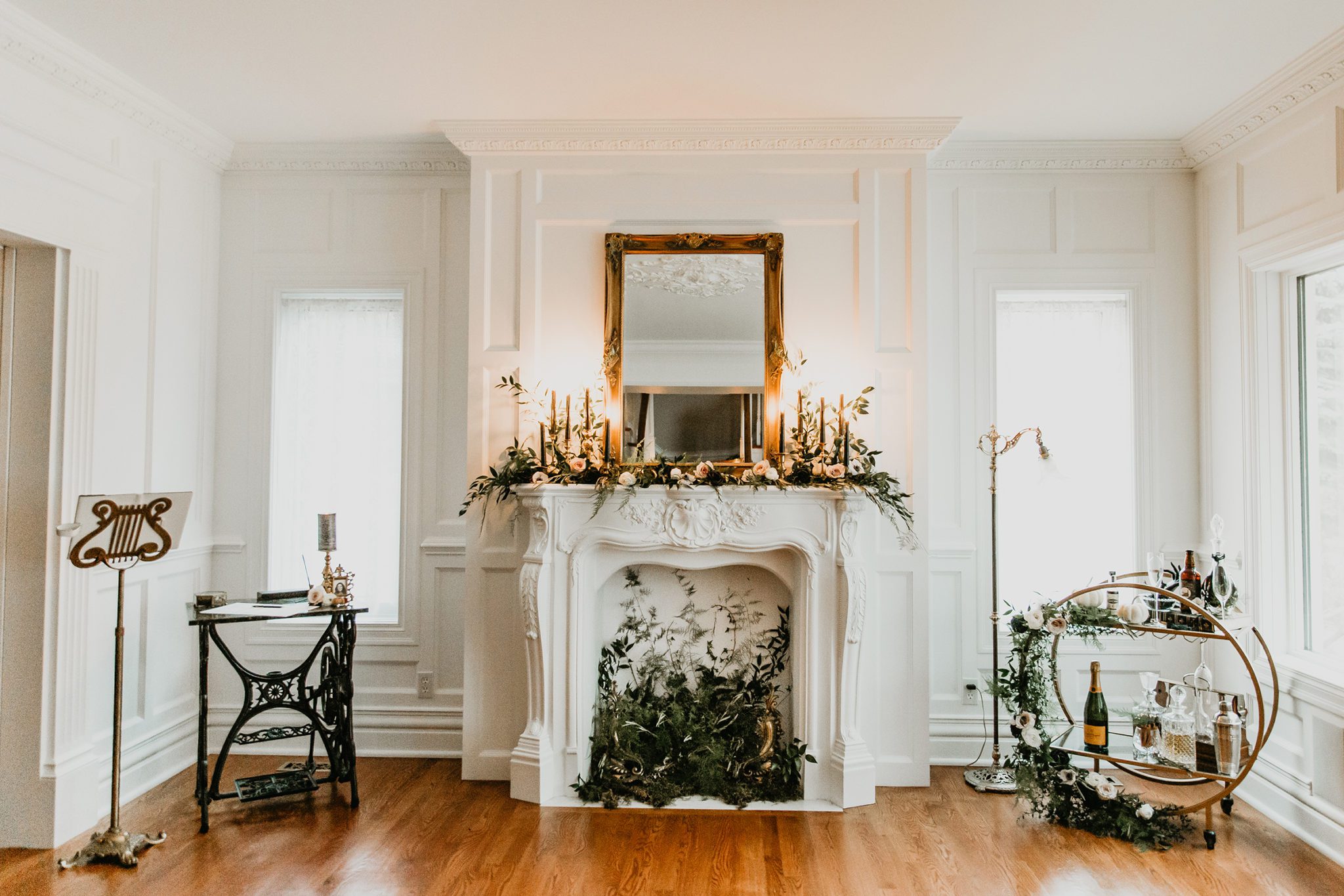 Elegant and romantic ceremony design inspiration for a living room wedding with a white fireplace